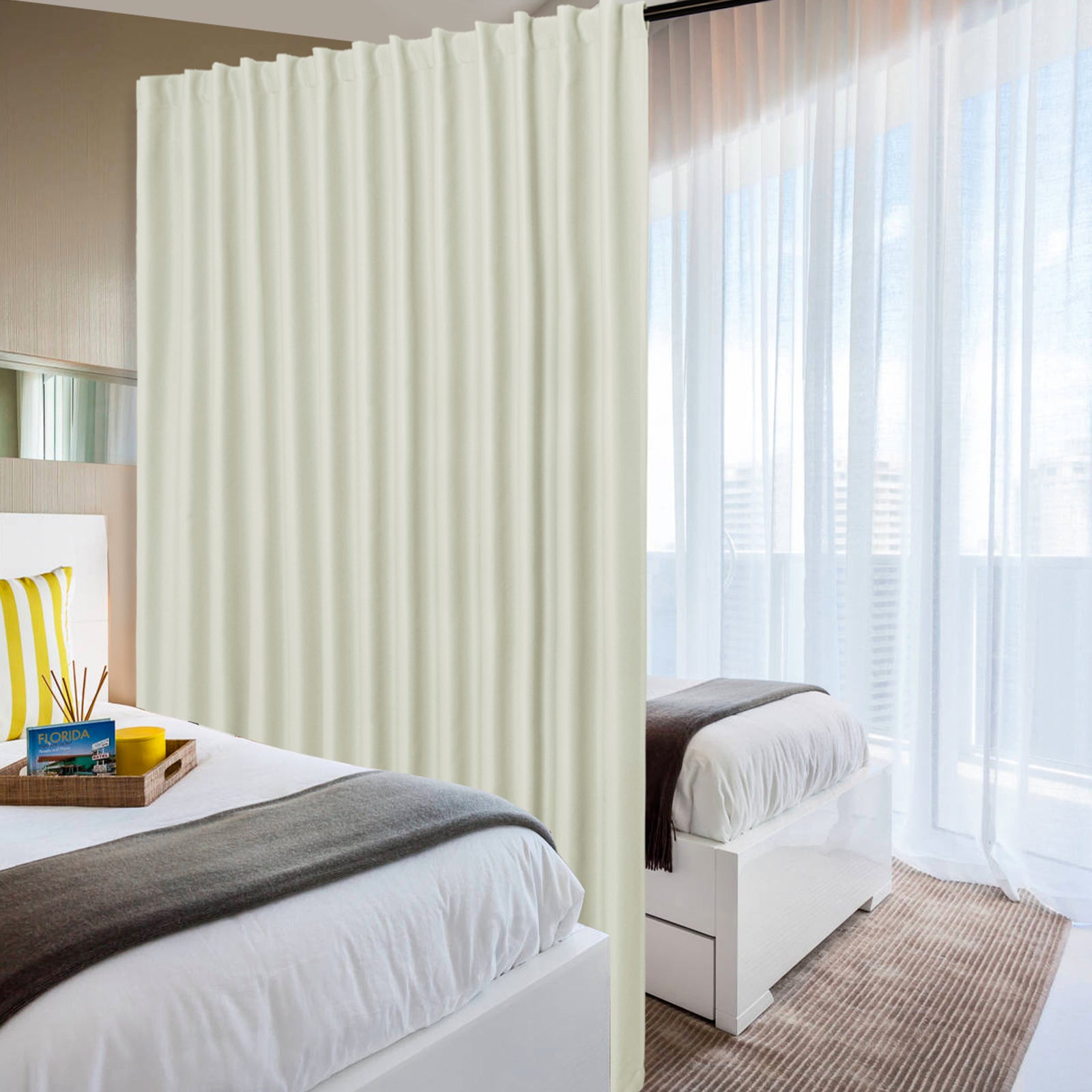 DWCN official black blackout curtain panel, wide width room divider curtain in black fabric hanging on a rod.