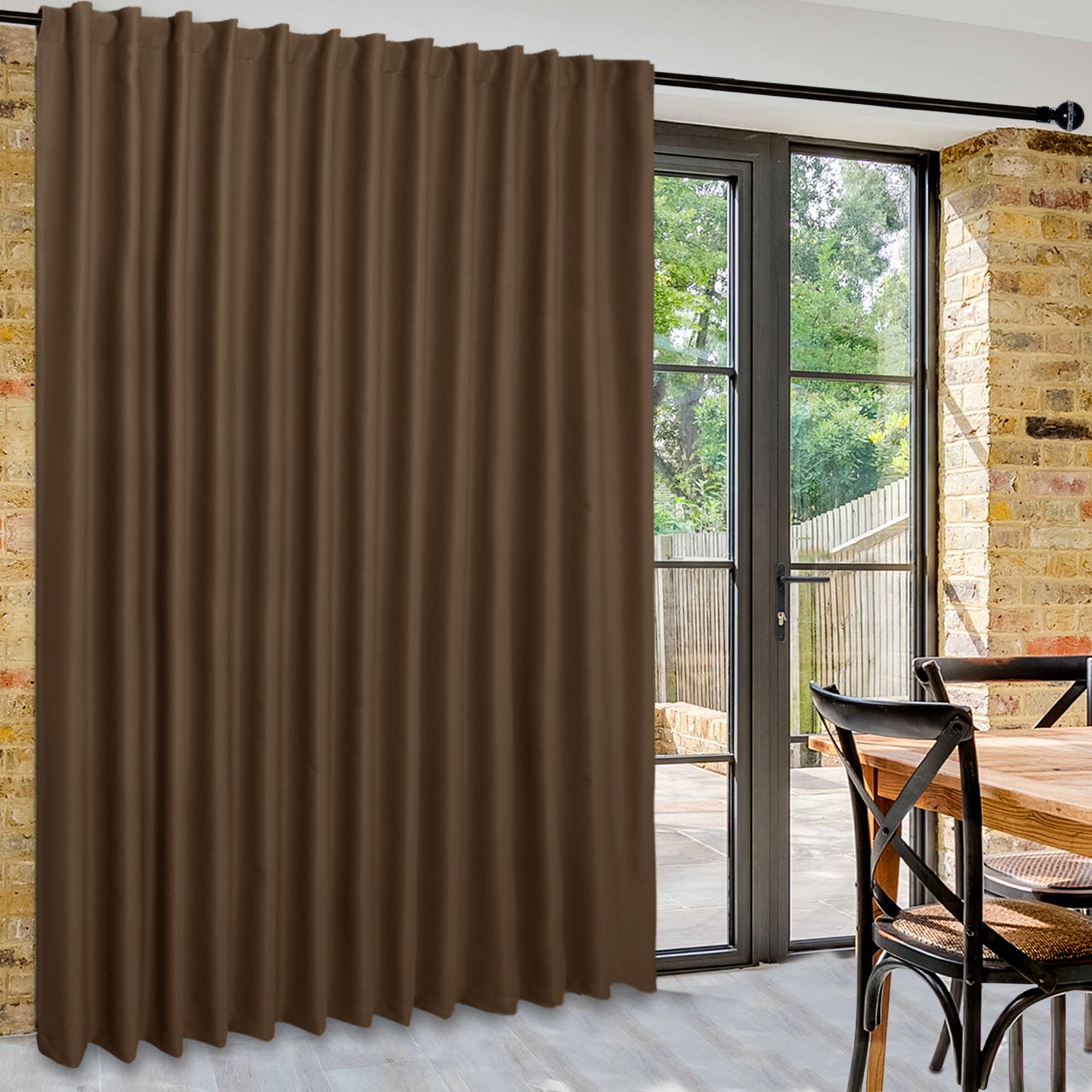 DWCN Official black wide-width blackout curtain used as room divider, featuring a sleek black fabric and modern design.