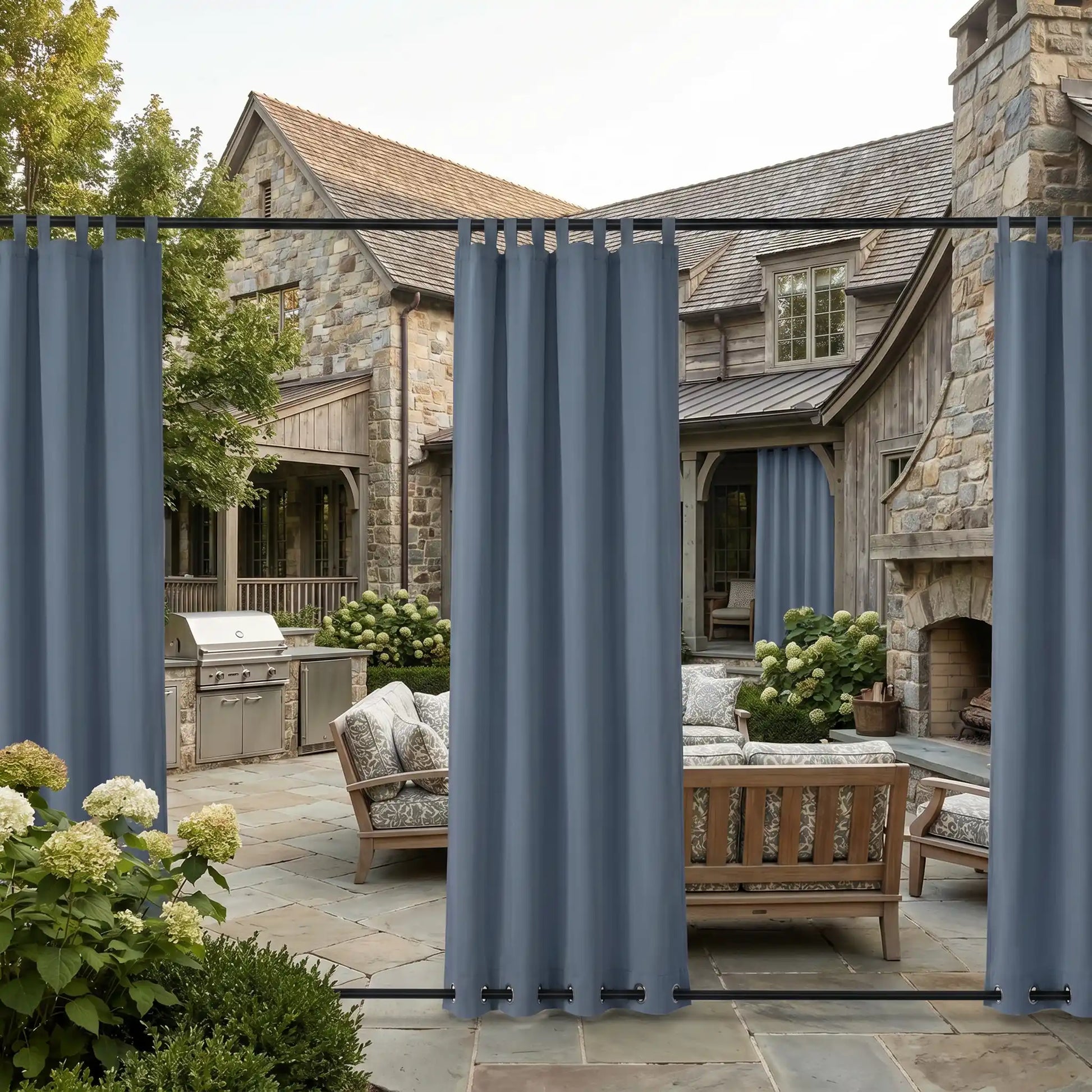 Windproof and waterproof outdoor curtains with tab top and grommet bottom by DWCN Official, shown hanging outdoors in a garden setting.