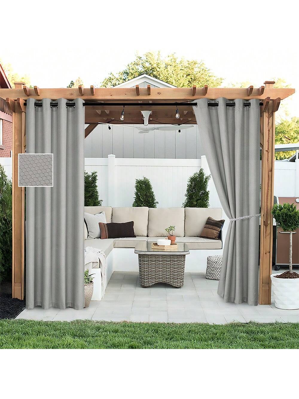 DWCN Outdoor Curtains in neutral fabric hanging outdoors, providing privacy and shade for patio or balcony areas.