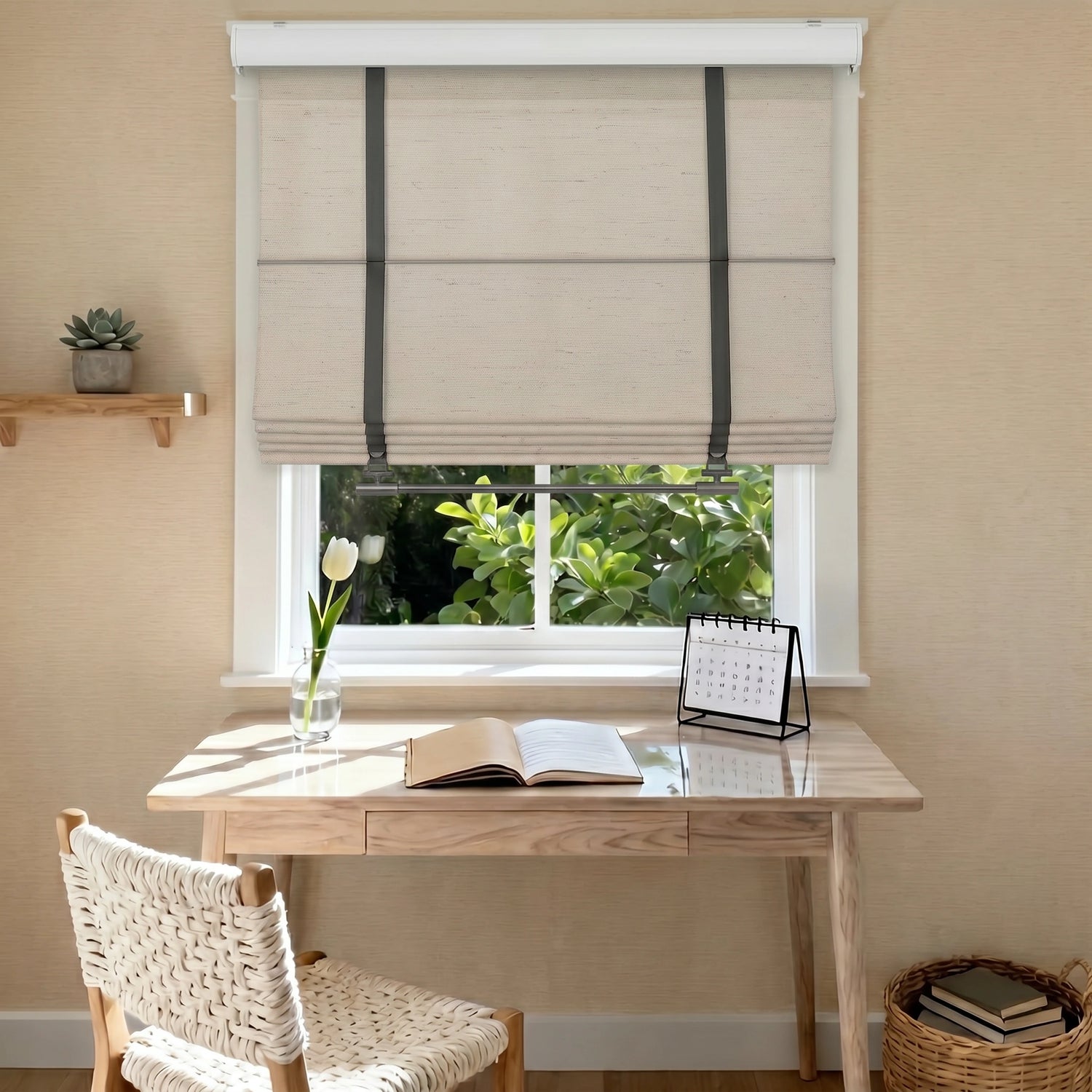 Made to measure Roman shades for a home office window, featuring beige linen fabric, leather-look straps, soft light filtering, and custom fit.