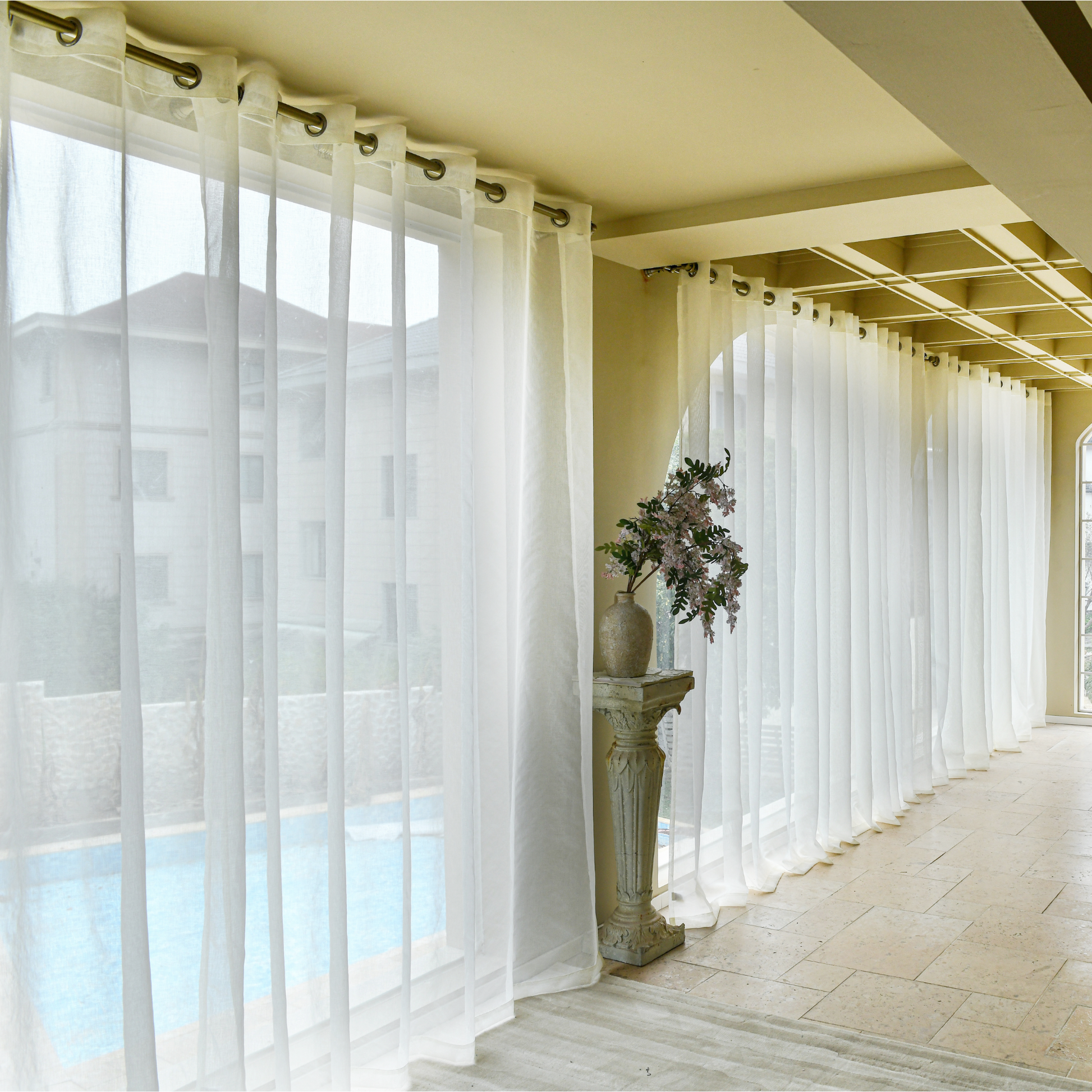Custom linen texture sheer curtains softly filtering natural light in living room