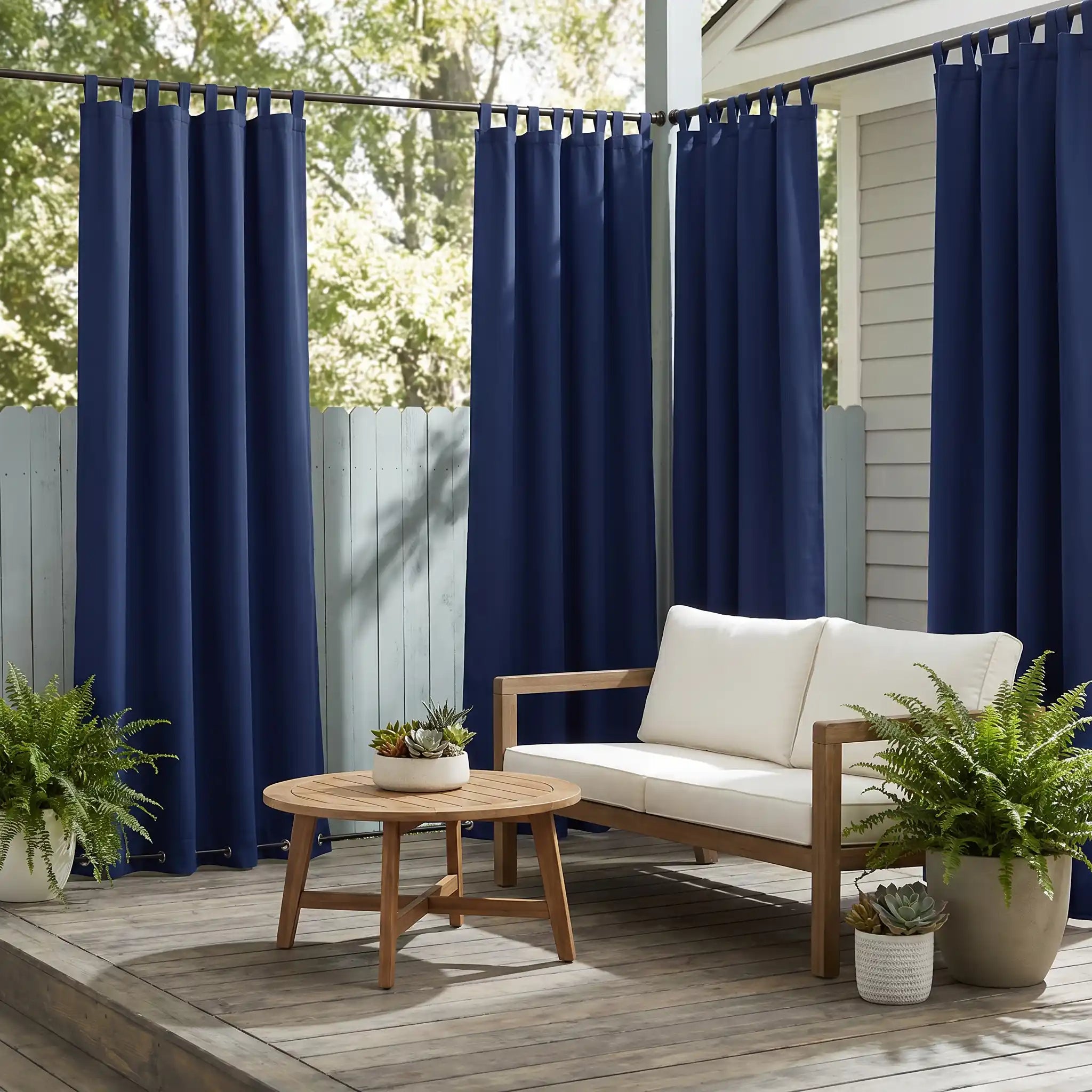 DWCN Official outdoor curtains with tab top and grommet bottom, windproof and waterproof for patio or balcony use.