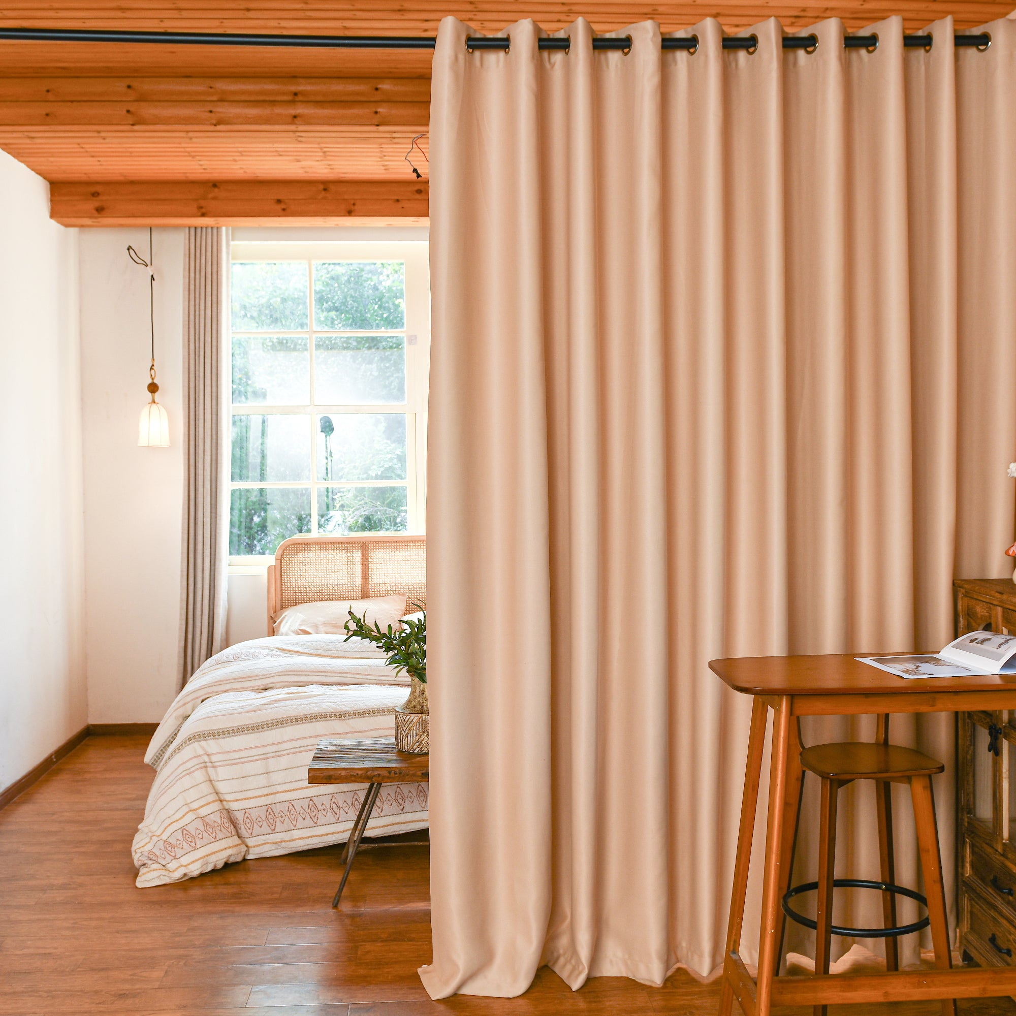 Luxury silk fiber blackout curtains used as room divider in modern apartment