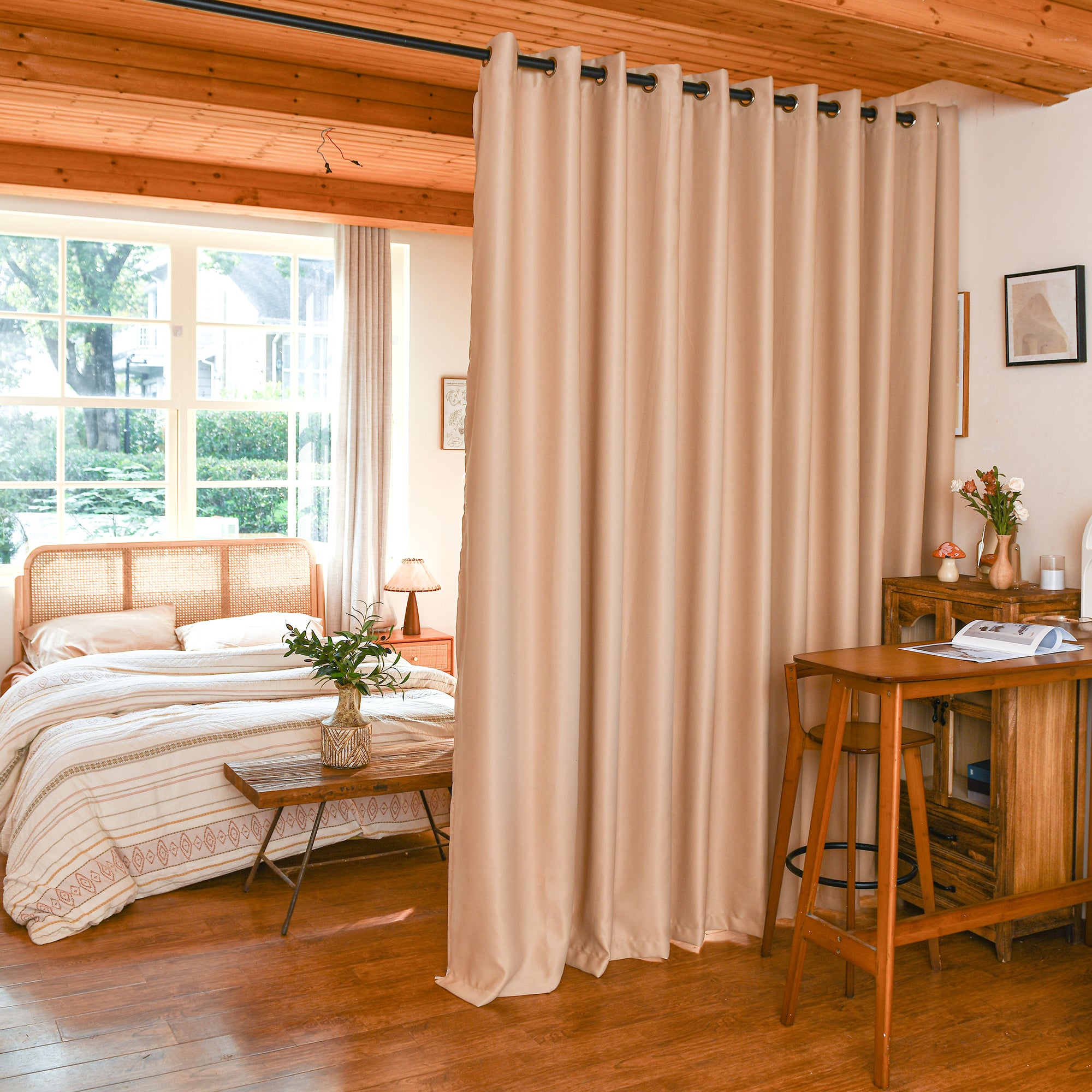 Custom blackout room divider curtains separating bedroom and living area