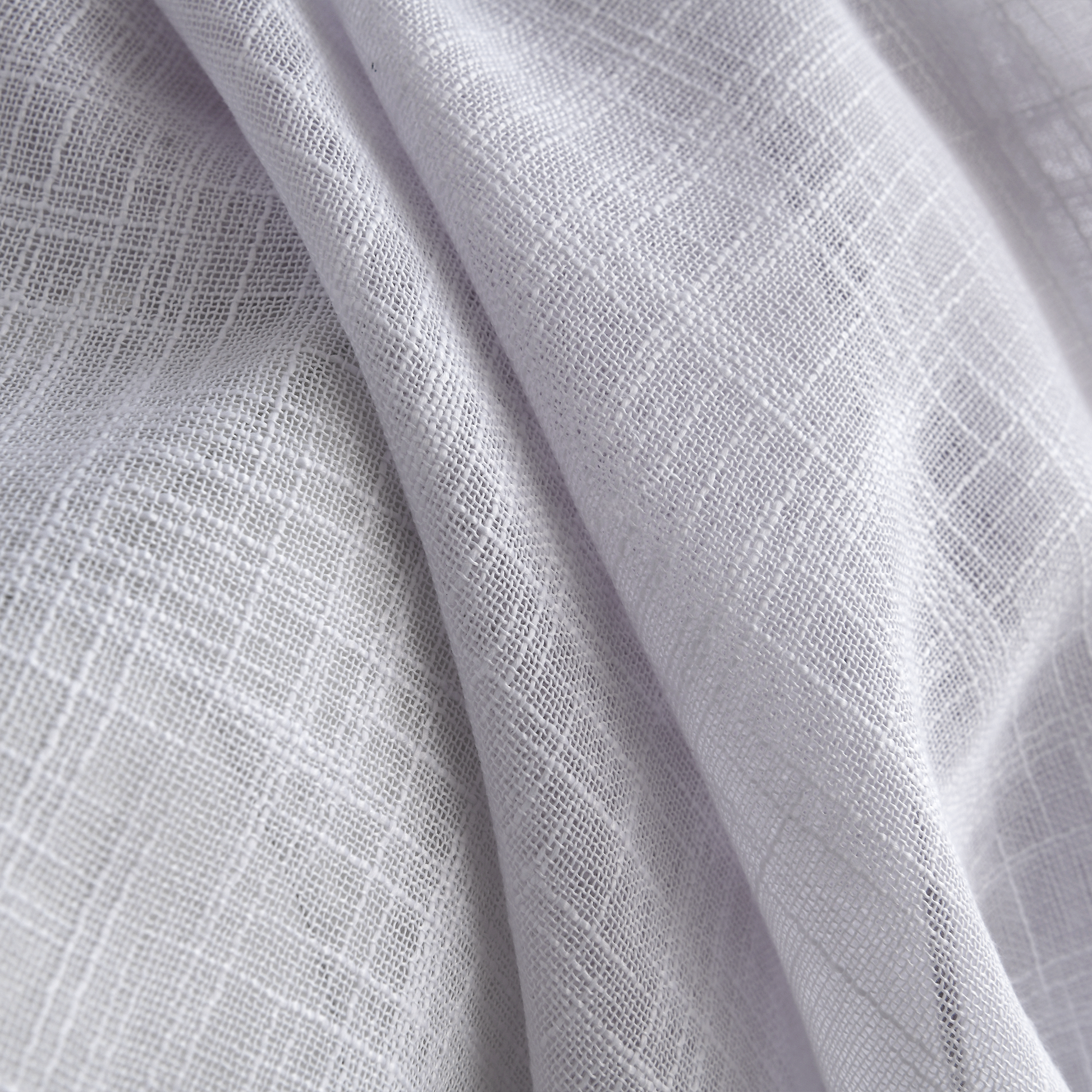 solid linen sheer curtains styled in bright home space
