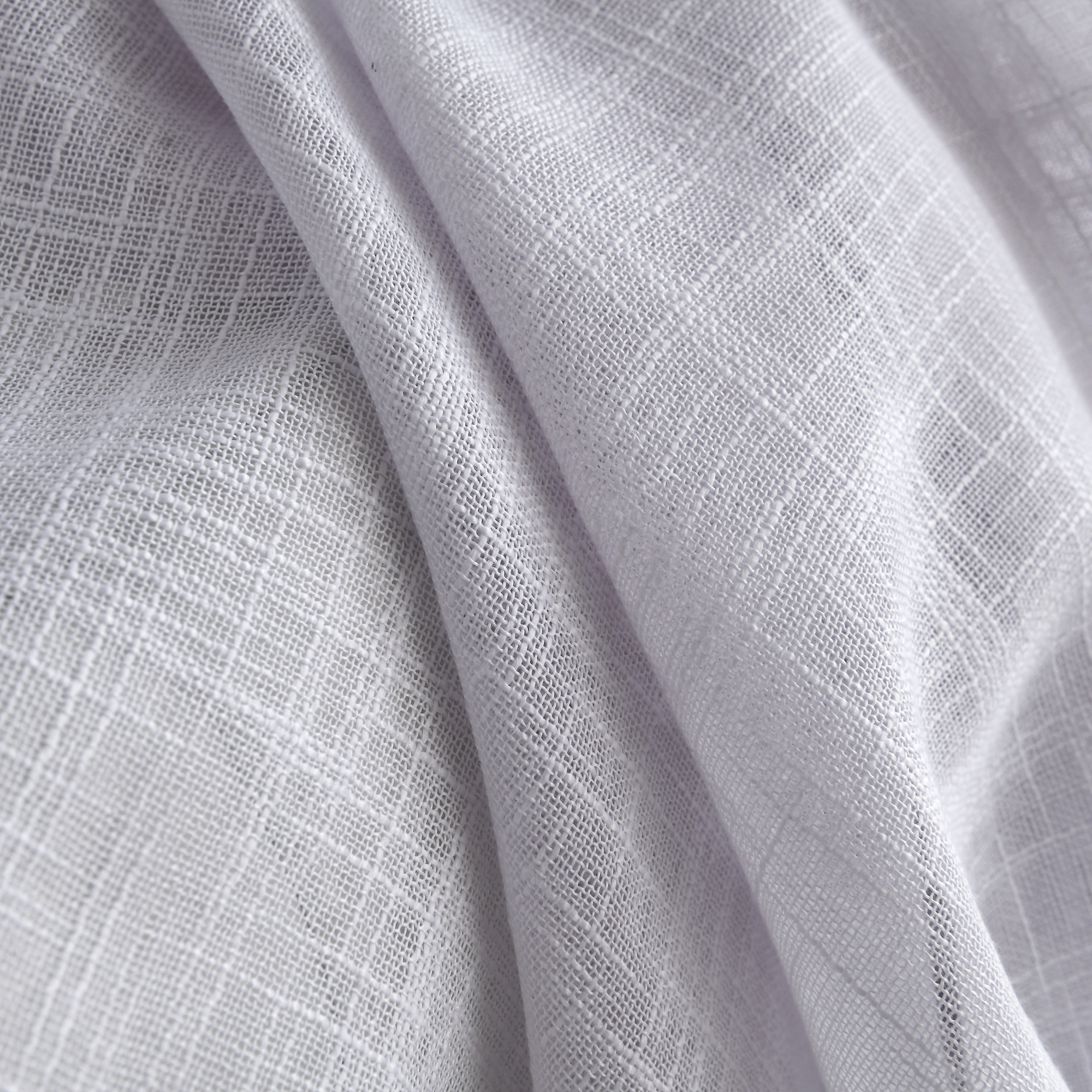 solid linen sheer curtains styled in bright home space