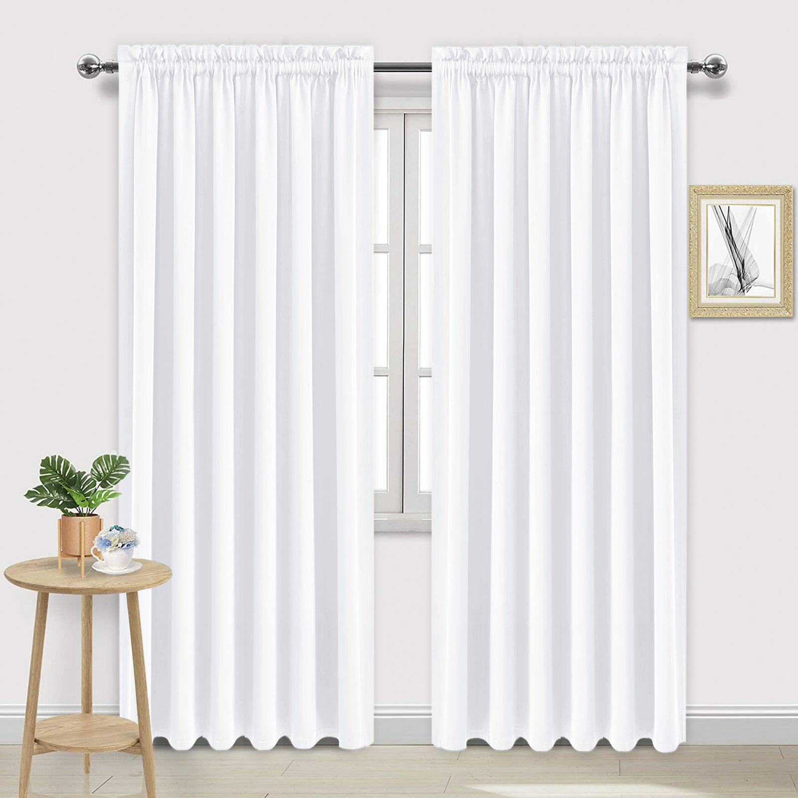 Set of two DWCN Official black blackout curtains with rod pocket design, dark fabric for light blocking and privacy.