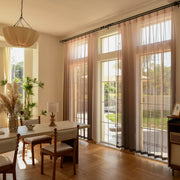 Custom vertical ombre sheer curtains in modern living room with soft natural light