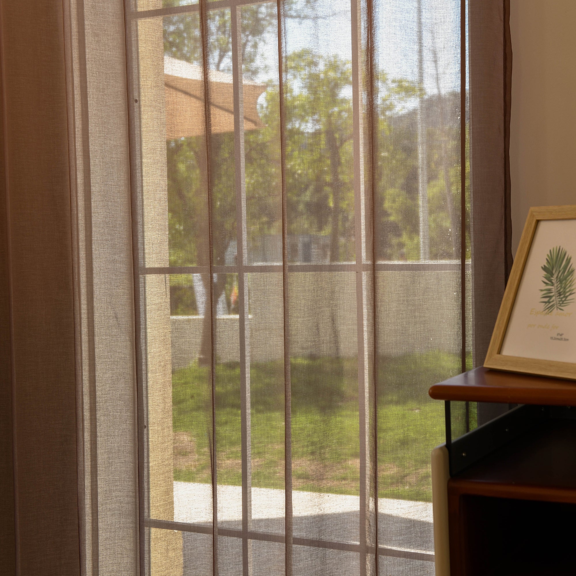Custom ombre sheer curtains filtering daylight in minimalist home setting