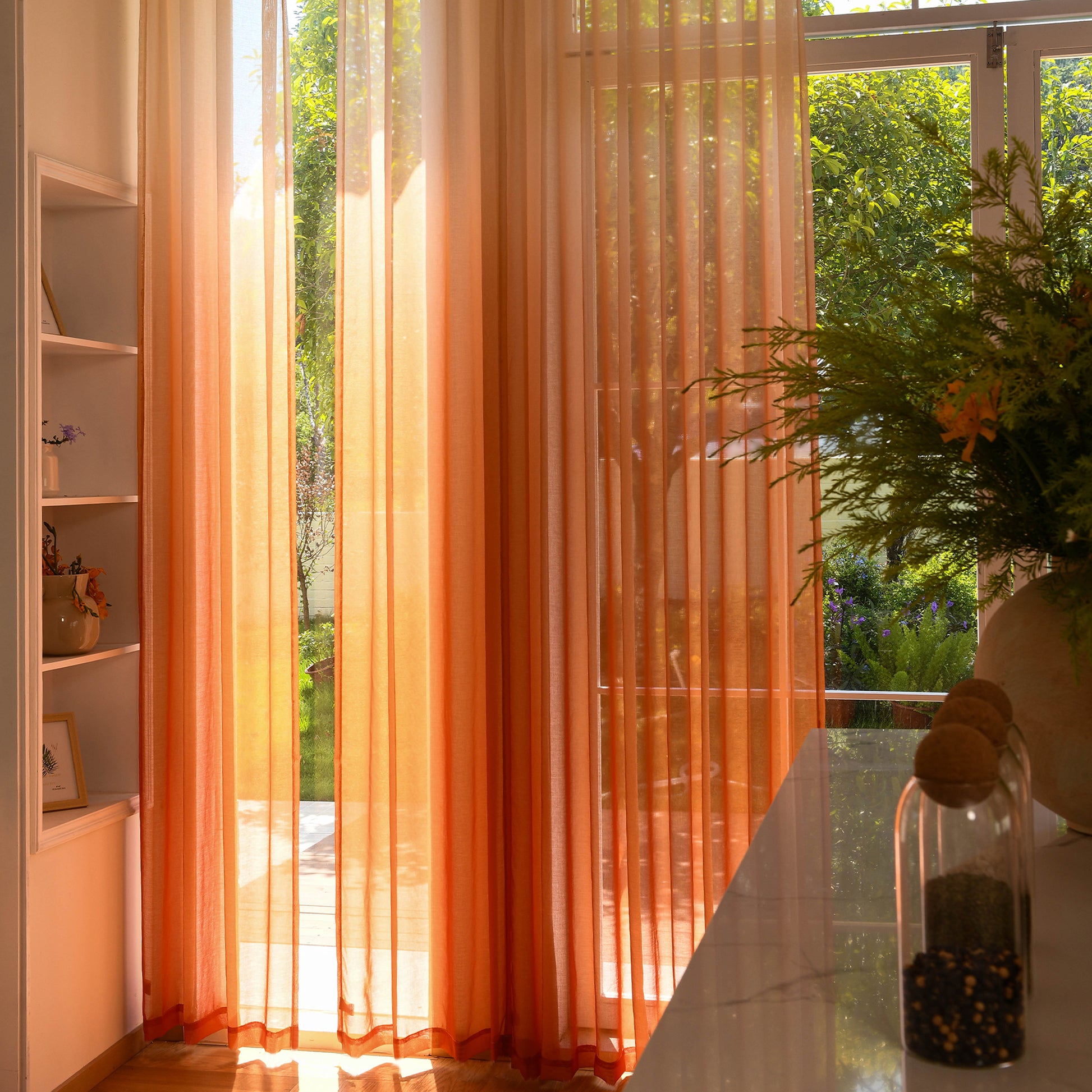 Custom ombre sheer curtains filtering daylight in minimalist home setting