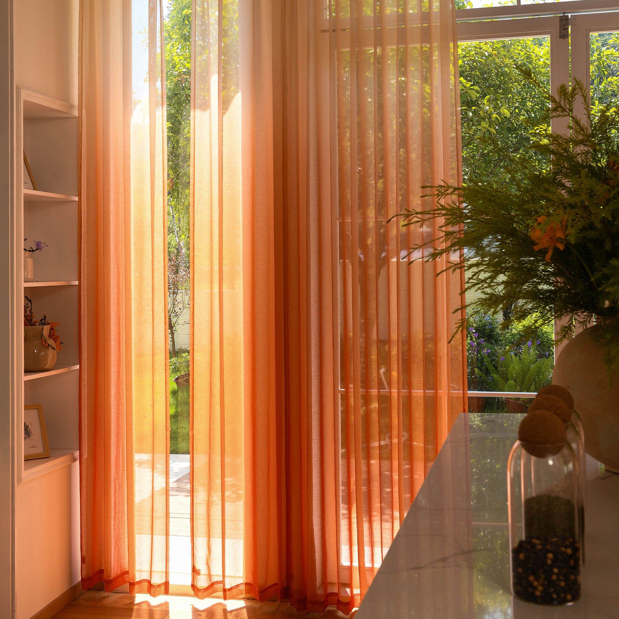 Custom ombre sheer curtains filtering daylight in minimalist home setting