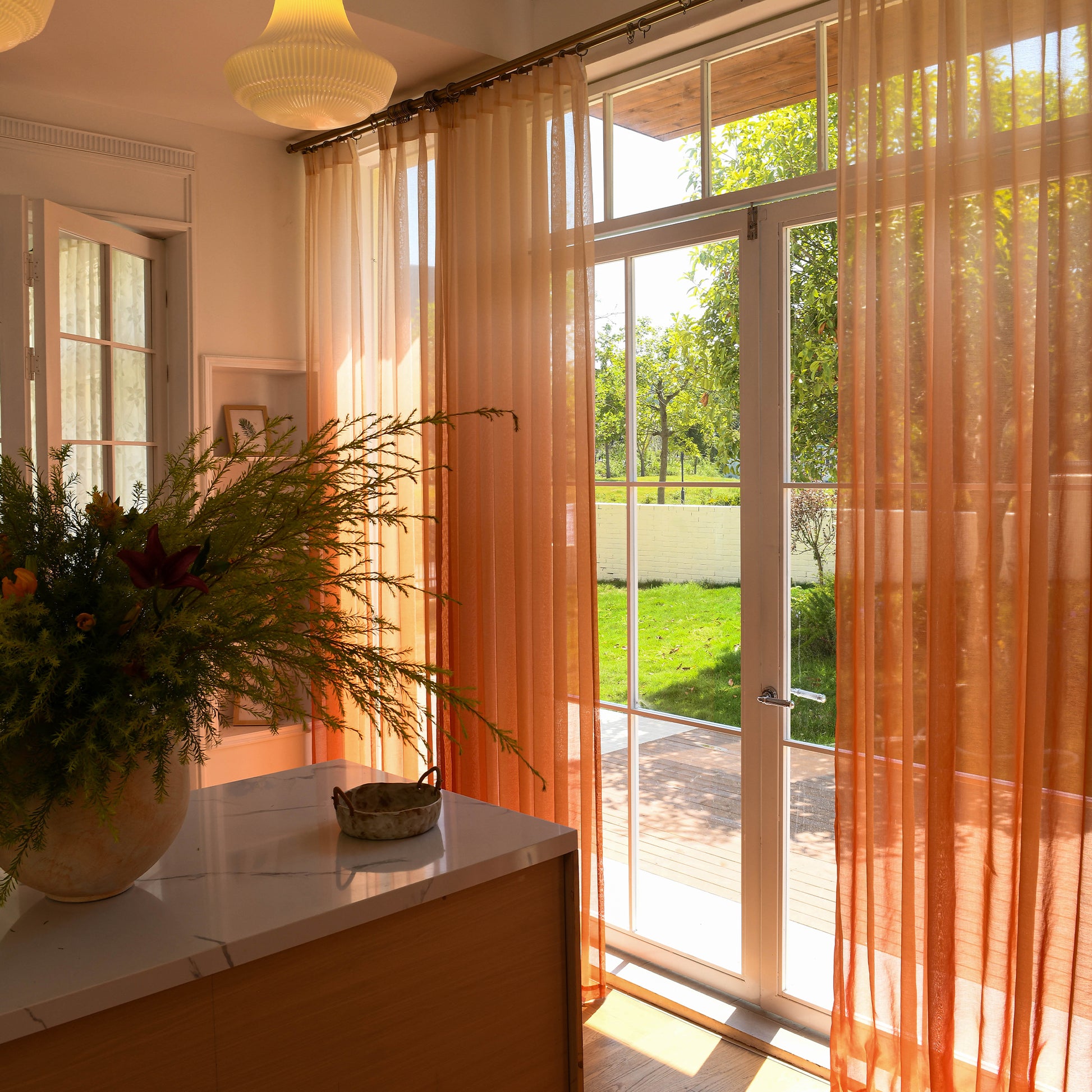 Custom ombre sheer curtains filtering daylight in minimalist home setting