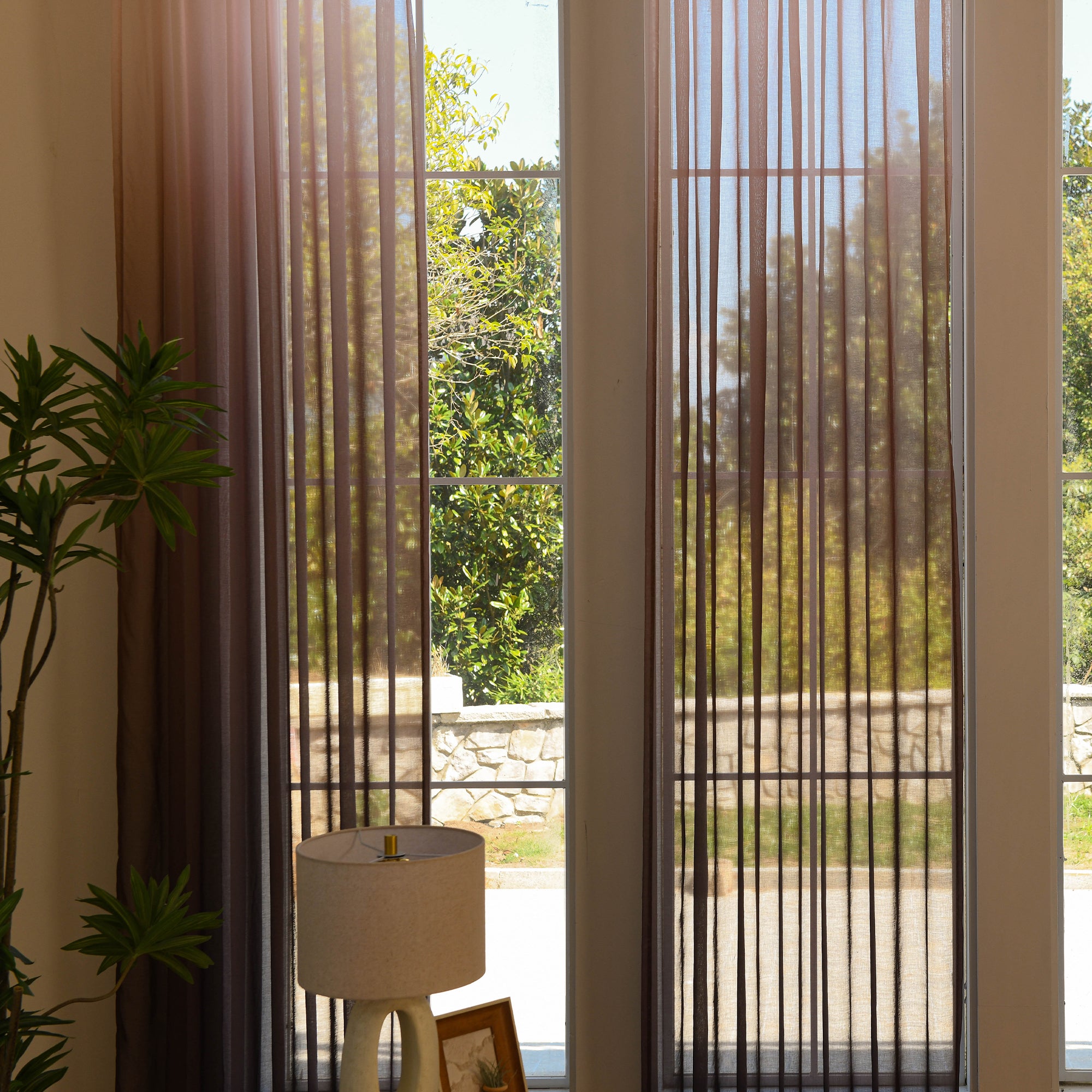Custom ombre sheer curtains filtering daylight in minimalist home setting