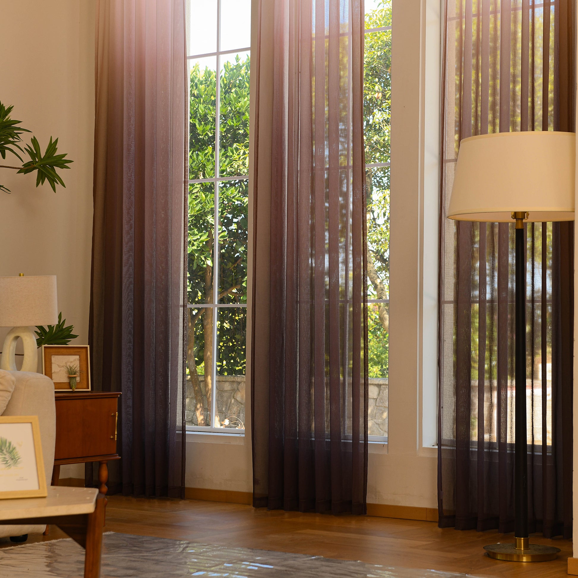 Linen texture ombre sheer curtains styled in large window interior scene