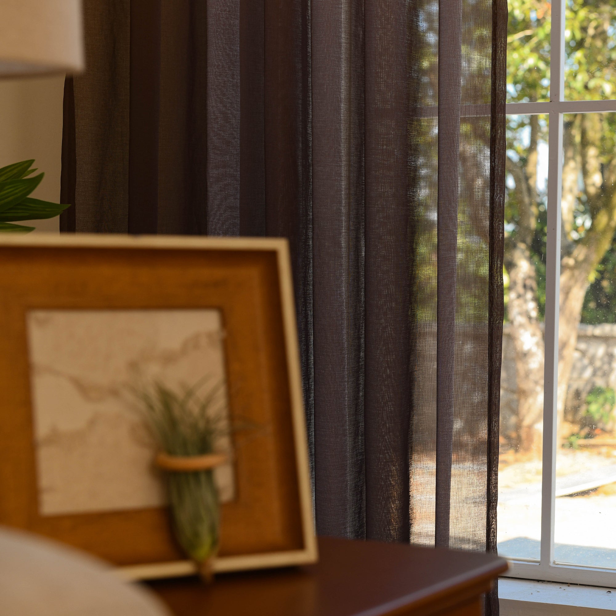 Custom ombre sheer curtains filtering daylight in minimalist home setting