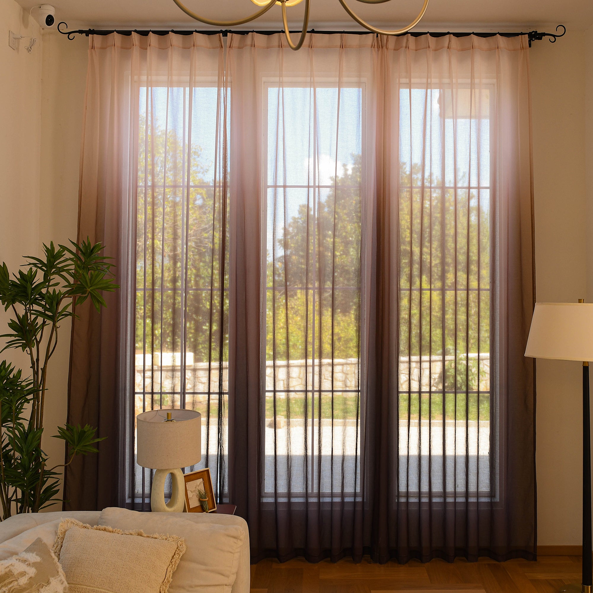 Custom ombre sheer curtains filtering daylight in minimalist home setting