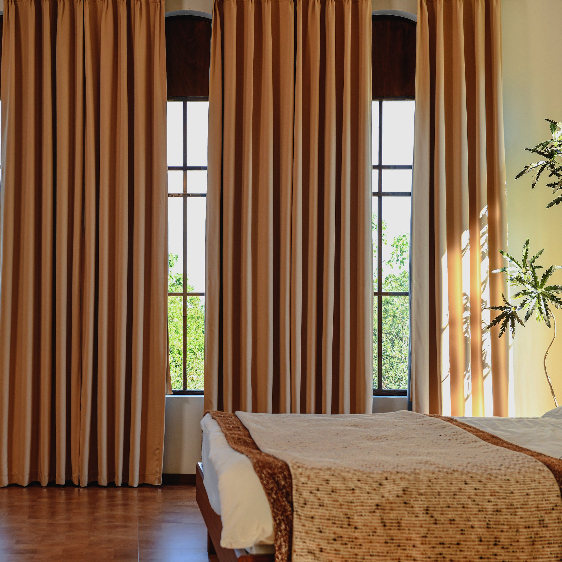 Luxury silk-fiber blackout curtains styled in neutral interior