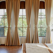 Custom silk-fiber blackout curtains in a modern bedroom setting