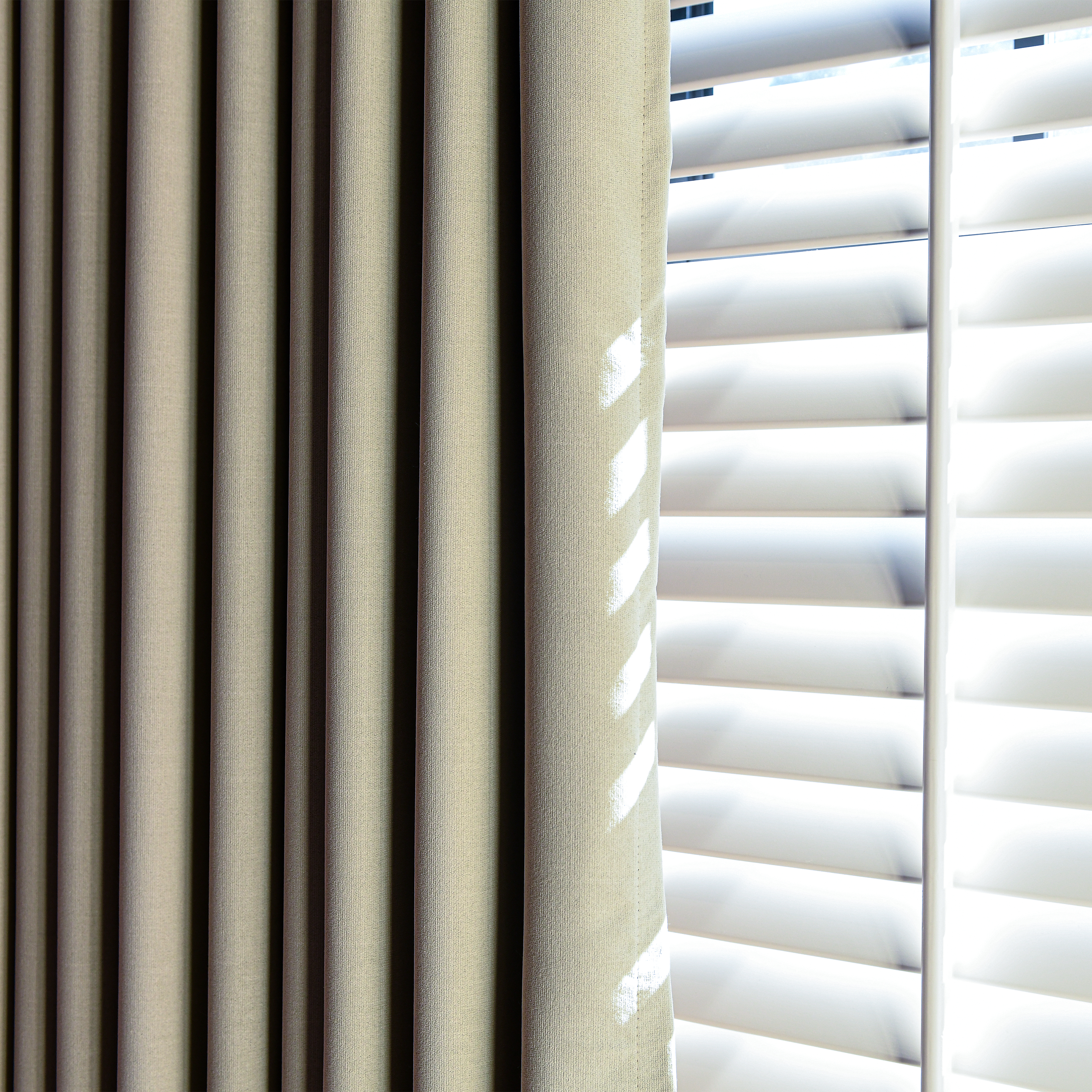 Black heavyweight cotton blackout curtains by DWCN Official, showing a close-up of the dark, soft fabric with a modern design.