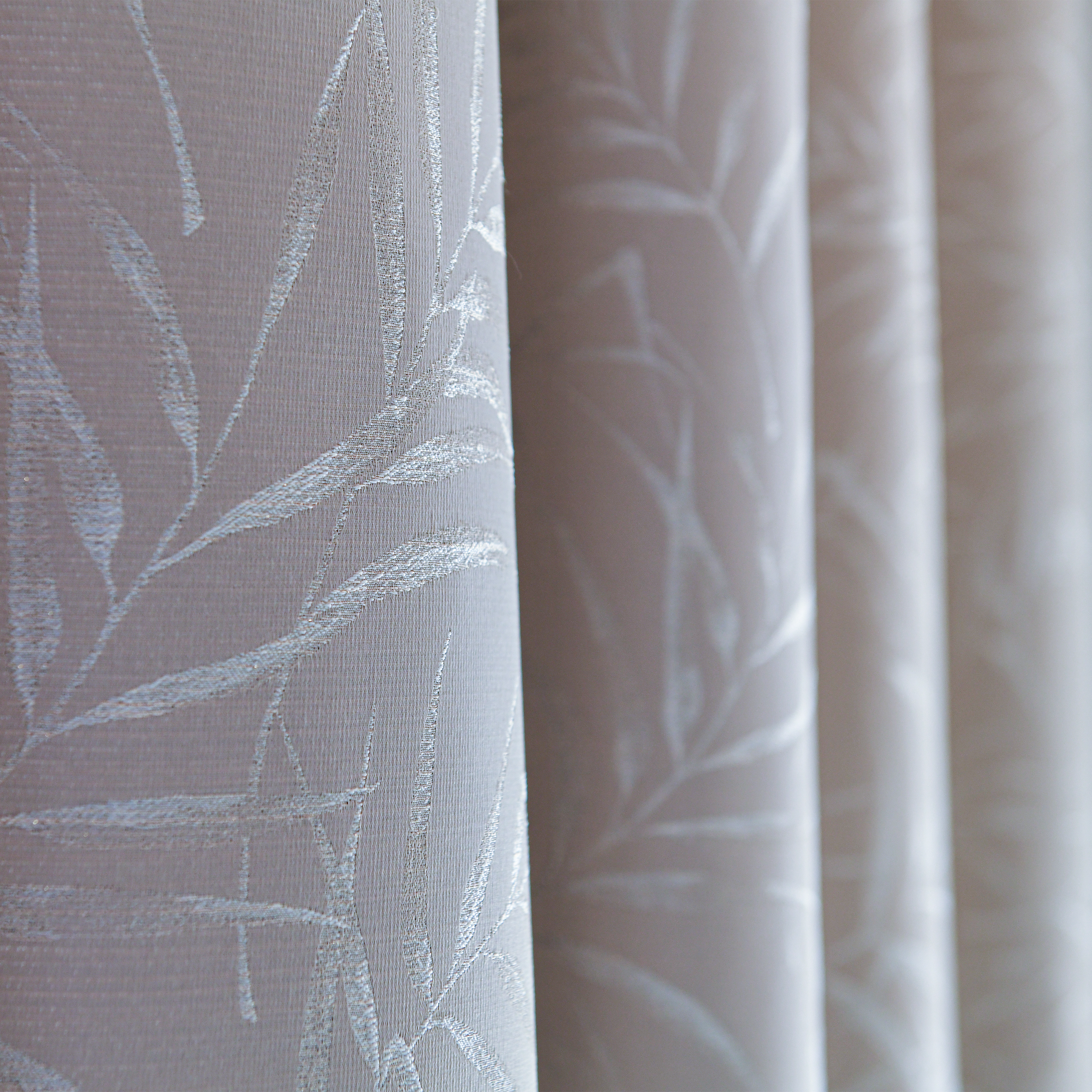 Elowen embroidered-pattern cotton curtain with floral design, featuring lightweight fabric and decorative embroidery from DWCN Official.