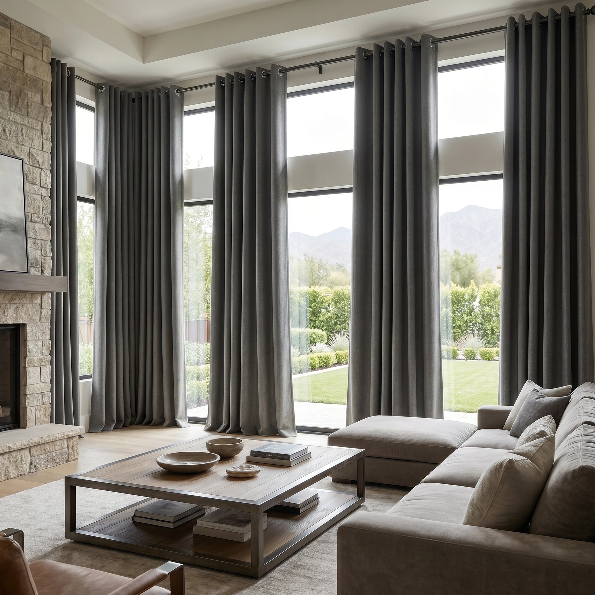 Dark grey custom DWCN Official heavyweight cotton blackout curtains hanging in a window, blocking out light and providing privacy.