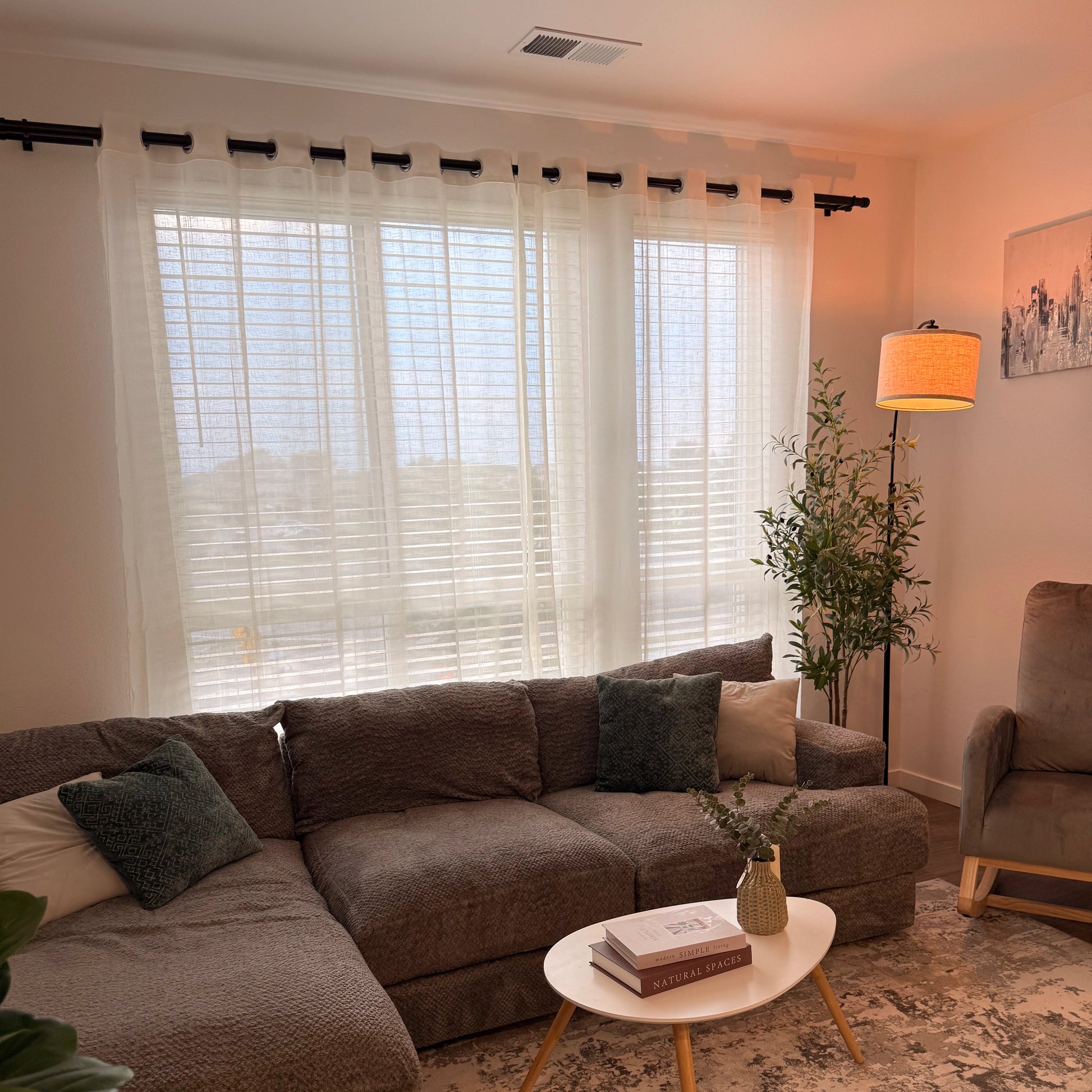 A custom DWCN Official Ariadne Pearl Crosshatch Linen Sheer Curtain hanging on a window, showcasing its light, airy fabric and elegant design.