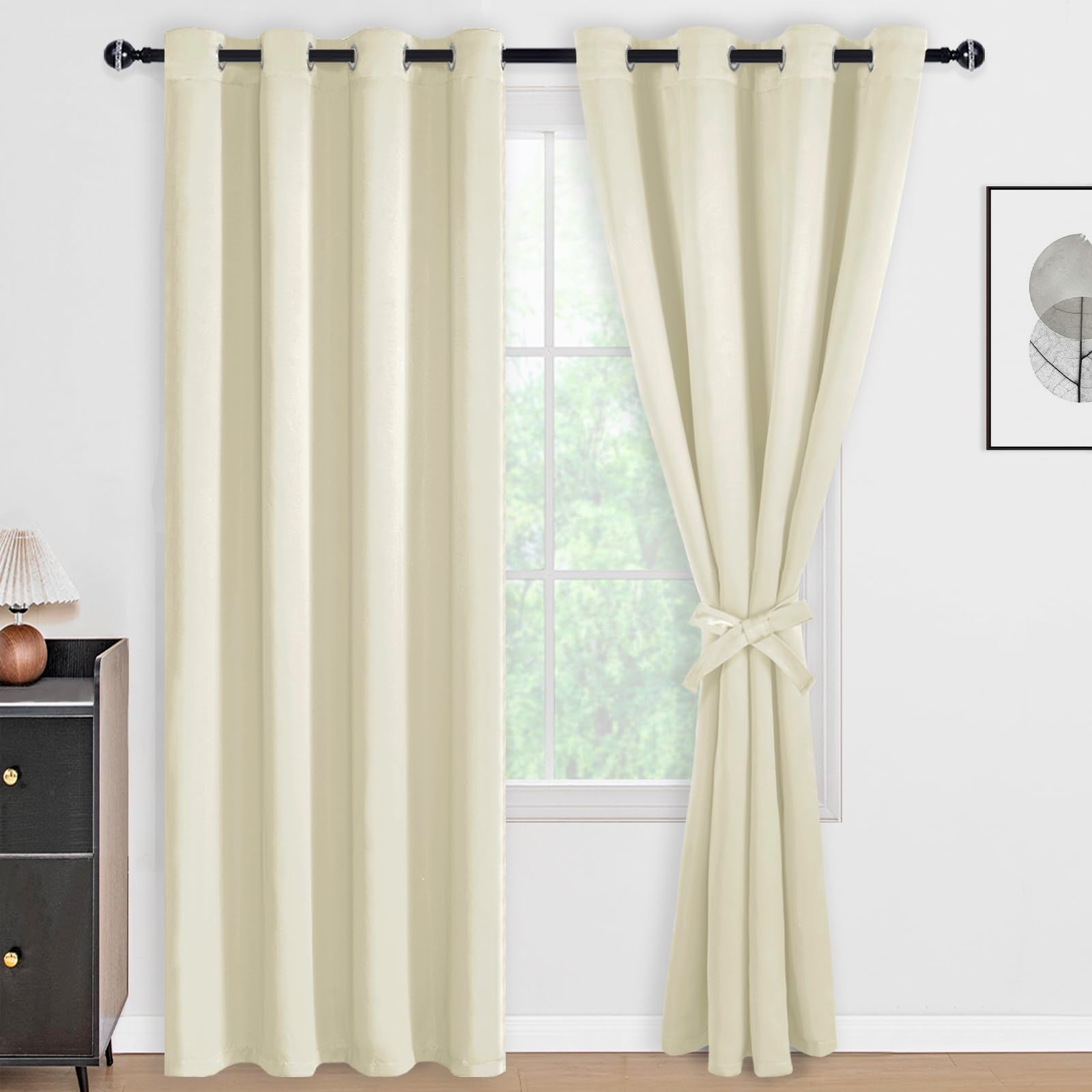 DWCN 100% blackout curtain panels with tiebacks, set of 2, in solid black fabric for light blocking and privacy.