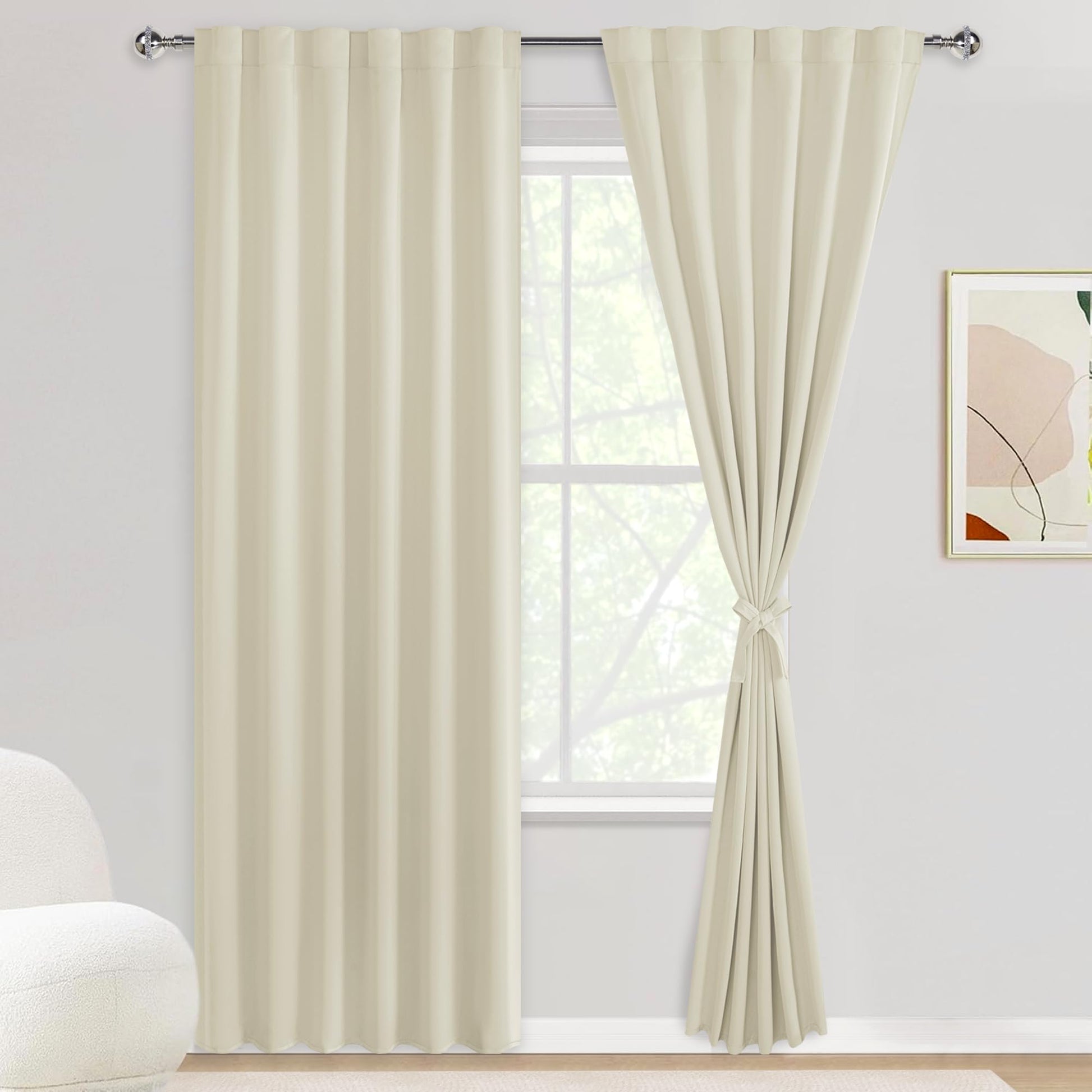 DWCN Blackout Curtains with tiebacks, rod pocket and back tab, set of 2 panels, in black fabric hanging on a window.