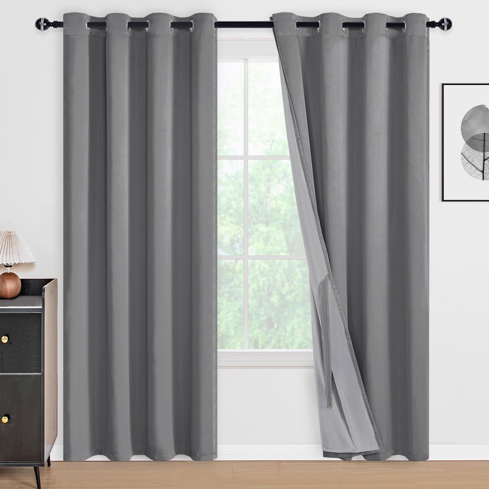 Pair of black blackout curtains with tiebacks from DWCN Official, featuring a sleek, solid black fabric and elegant tieback accessories.