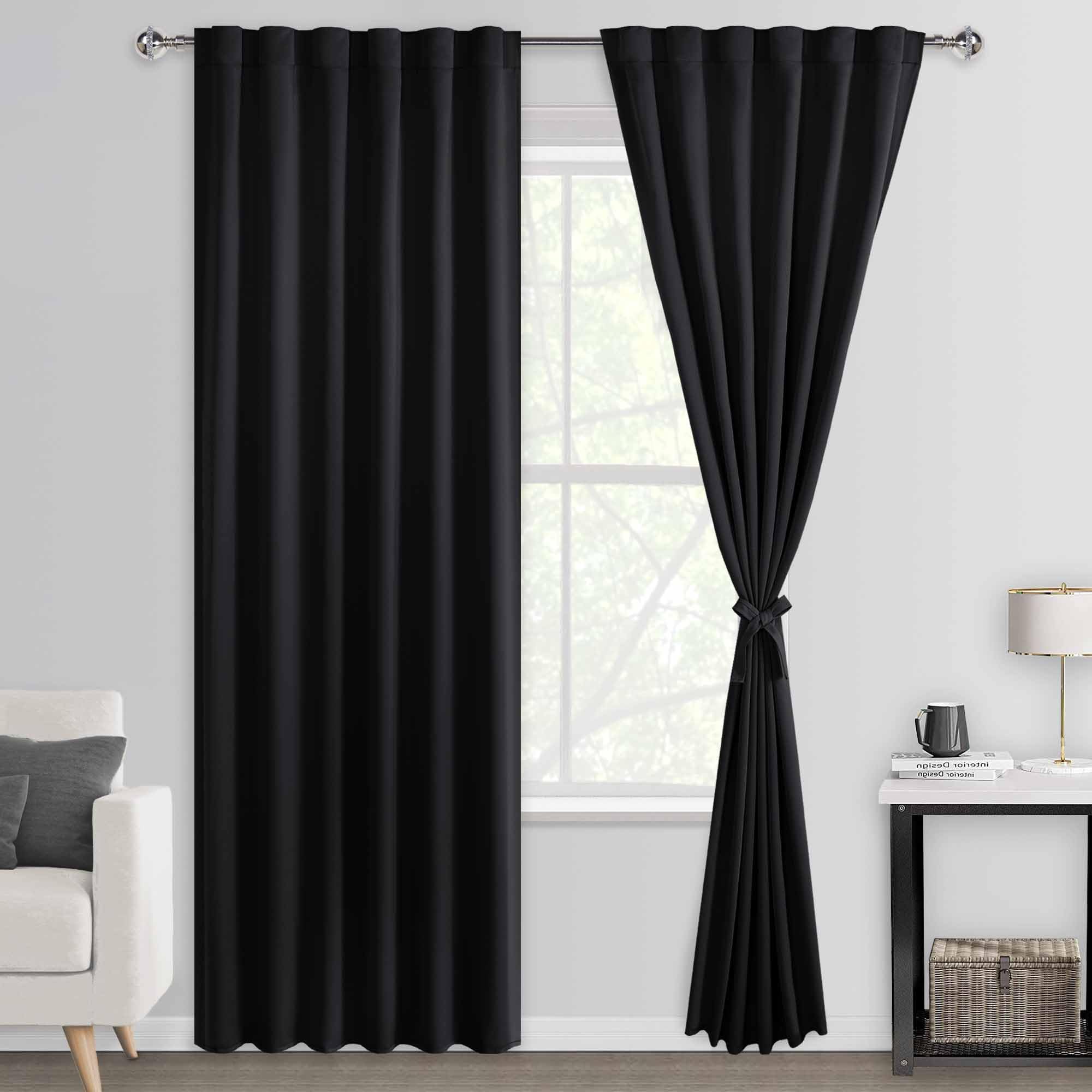 Pair of DWCN Official black blackout curtains with tiebacks, rod pocket and back tab design, set of two panels hanging on a window