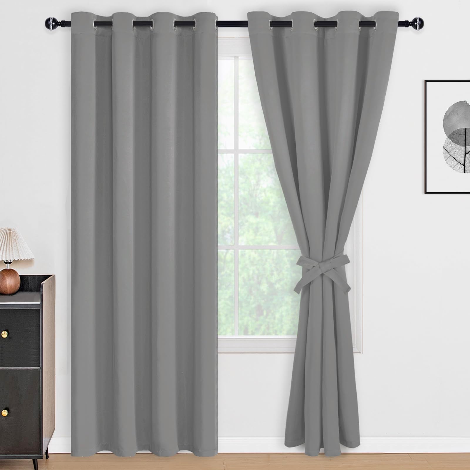 DWCN 100% blackout curtains with tiebacks, set of 2 panels, in sleek black fabric for light blocking and privacy.