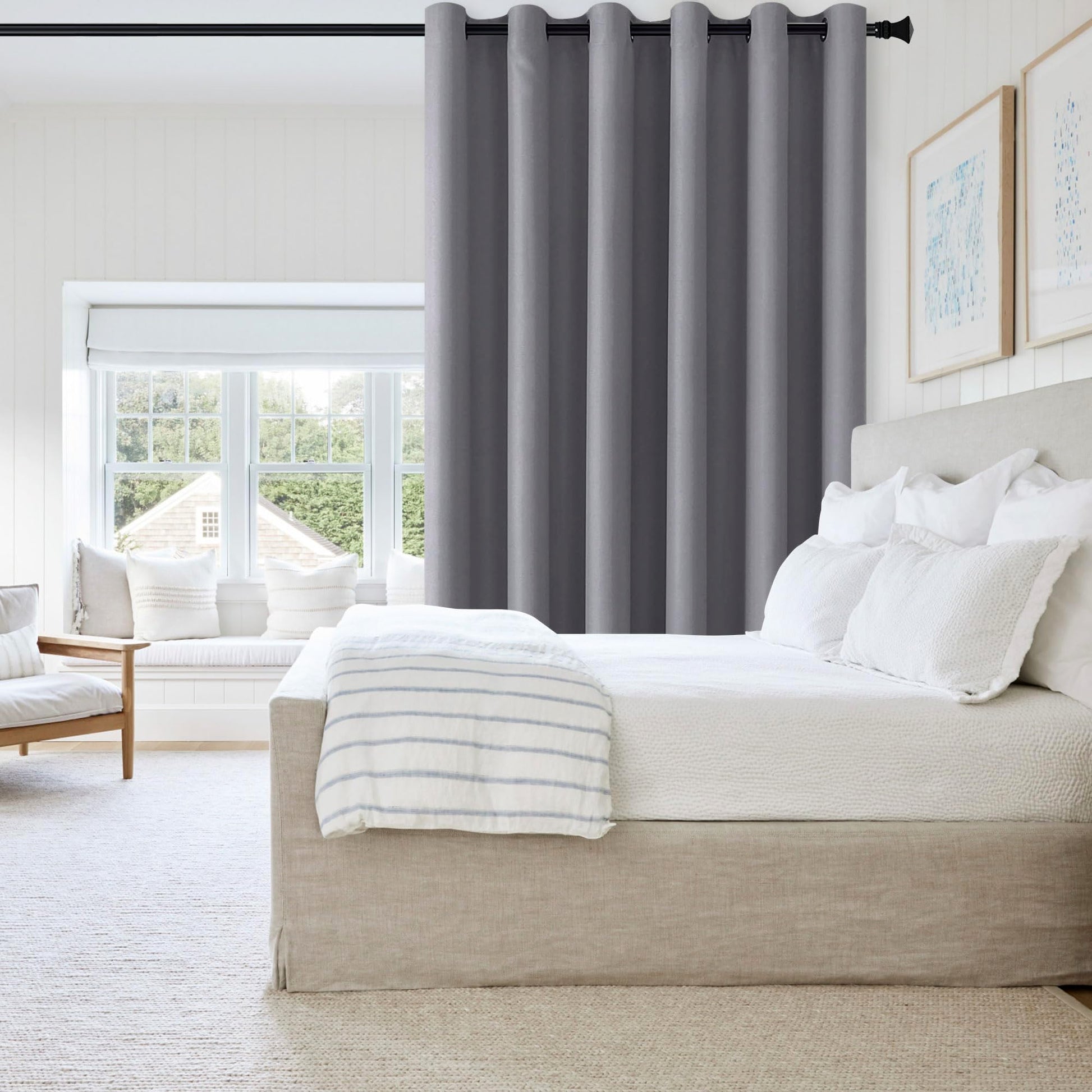 DWCN Blackout Curtain Panel with grommets, room divider curtain in solid black fabric, ideal for blocking light and creating privacy.