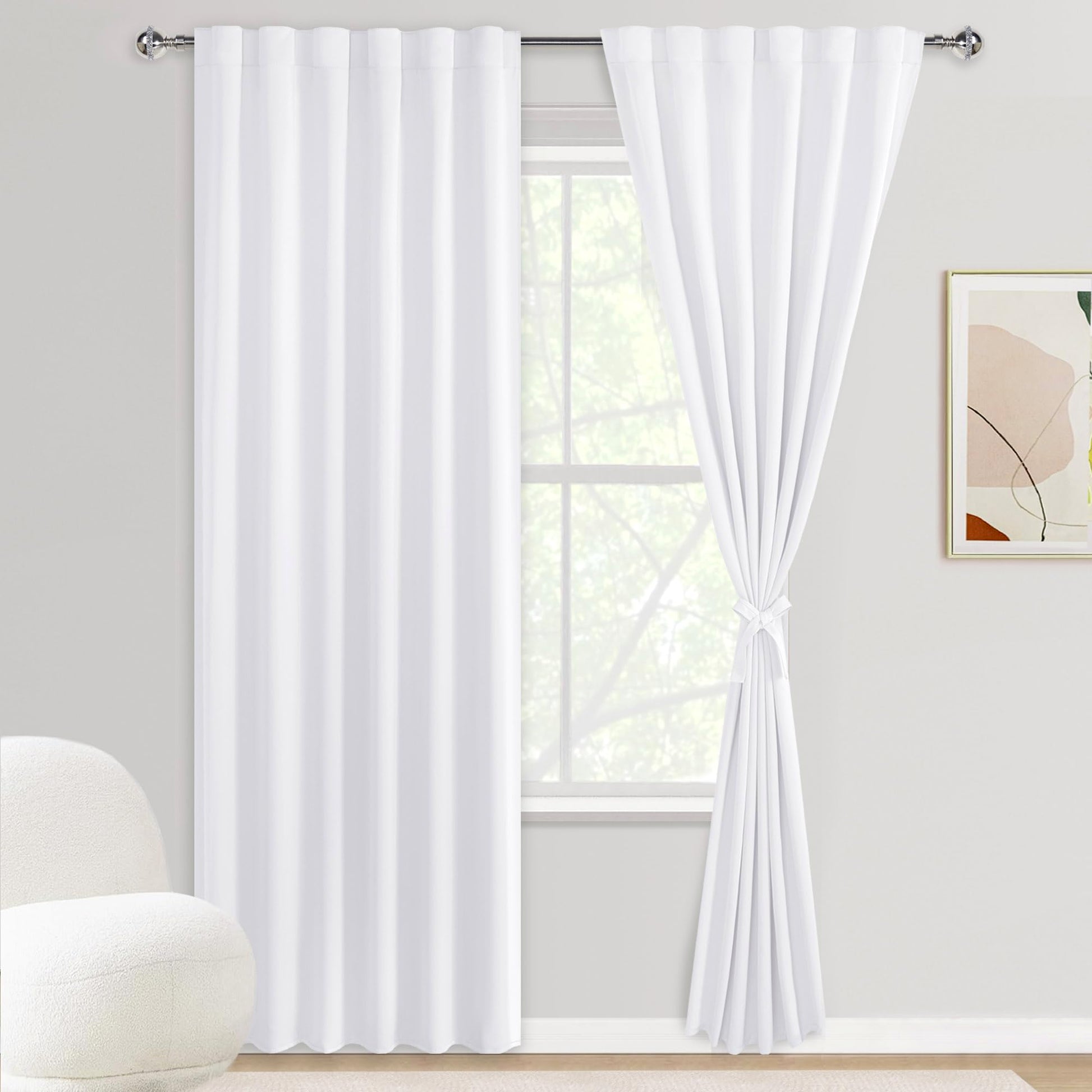 DWCN Official blackout curtain panels with tiebacks, rod pocket and back tab design, set of 2 in black fabric hanging on a window.
