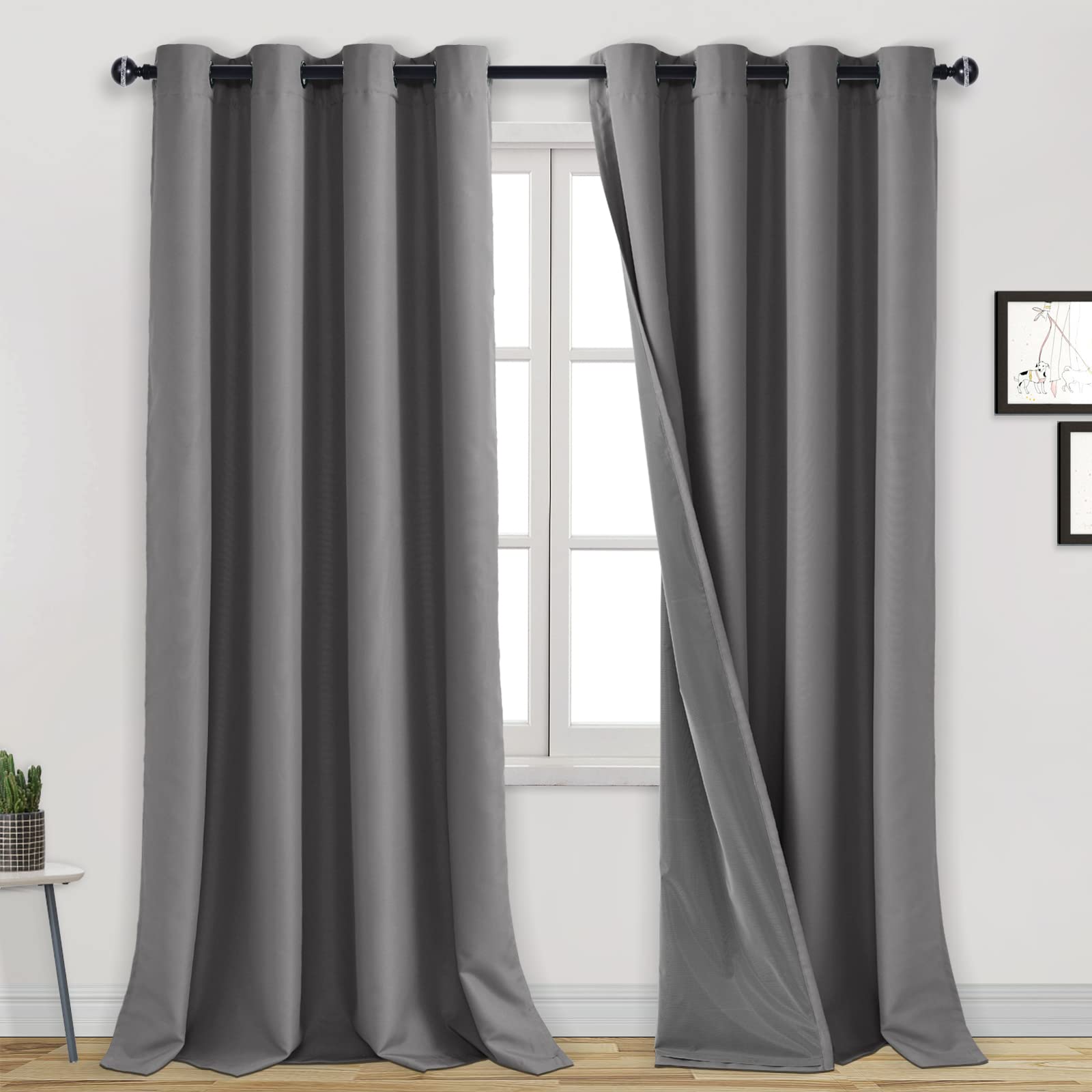Blackout curtains with grommet top design by DWCN Official, showcasing 100% blackout fabric in solid black for room darkness.