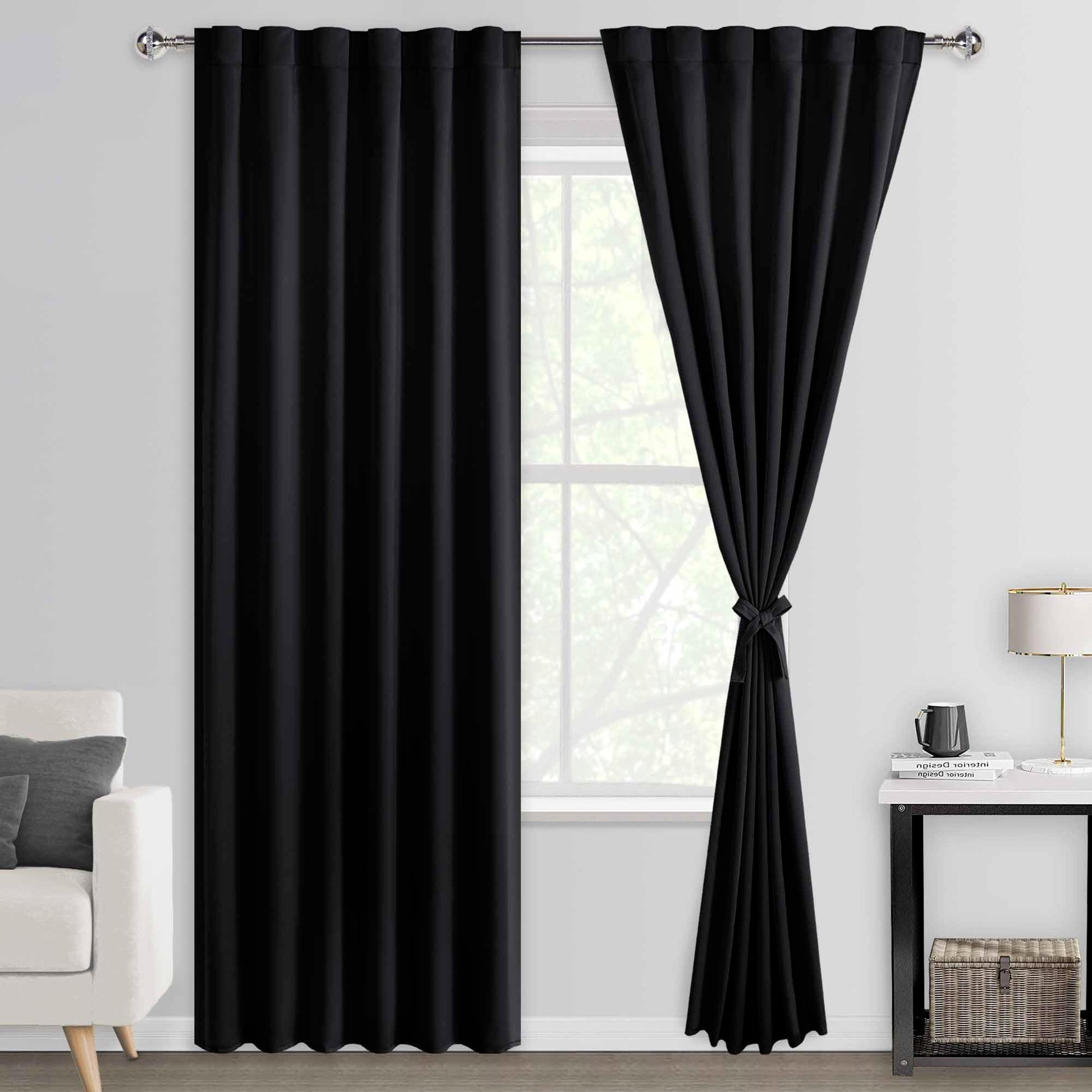 Pair of DWCN Blackout Curtains with tiebacks, rod pocket and back tab design, set of two panels hanging on a window.