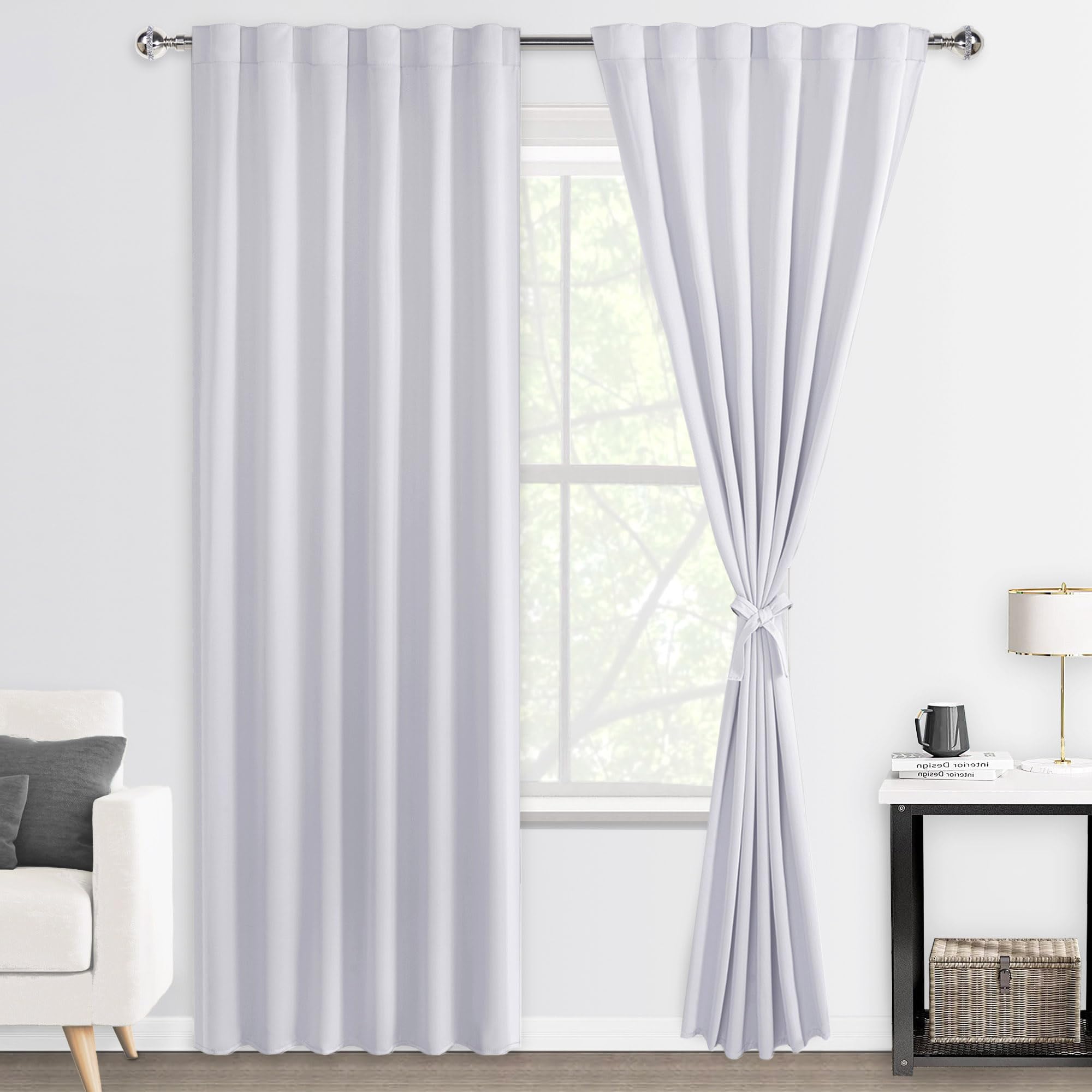 DWCN Blackout Curtains with tiebacks, rod pocket and back tab design, set of 2 panels hanging in a modern bedroom window.