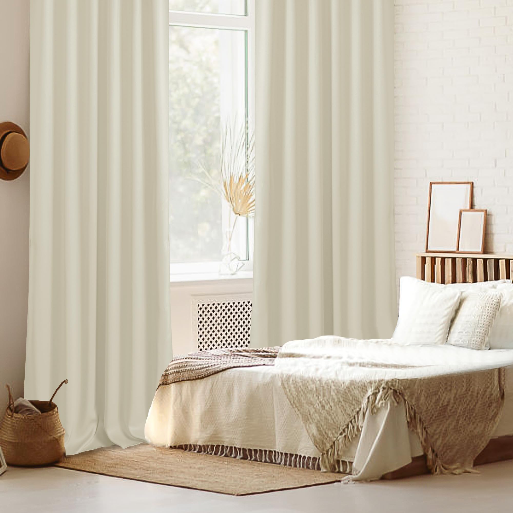 Pair of DWCN Blackout Curtains with tiebacks, rod pocket and back tab design, set of two panels hanging in a window.