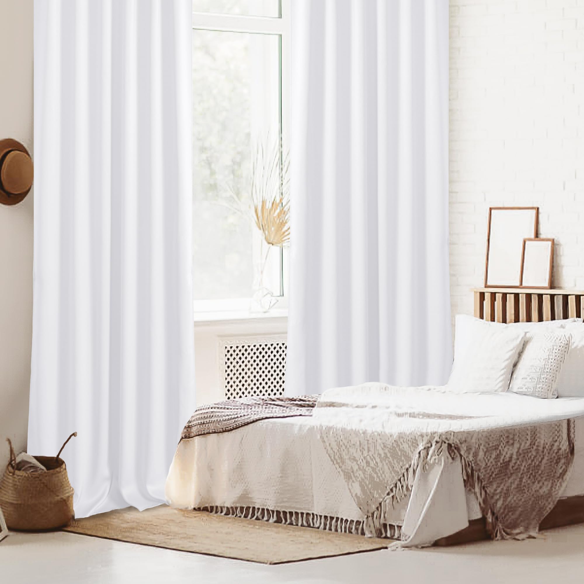 Set of two DWCN Blackout Curtains with tiebacks, rod pocket and back tab design, shown hanging in a window.