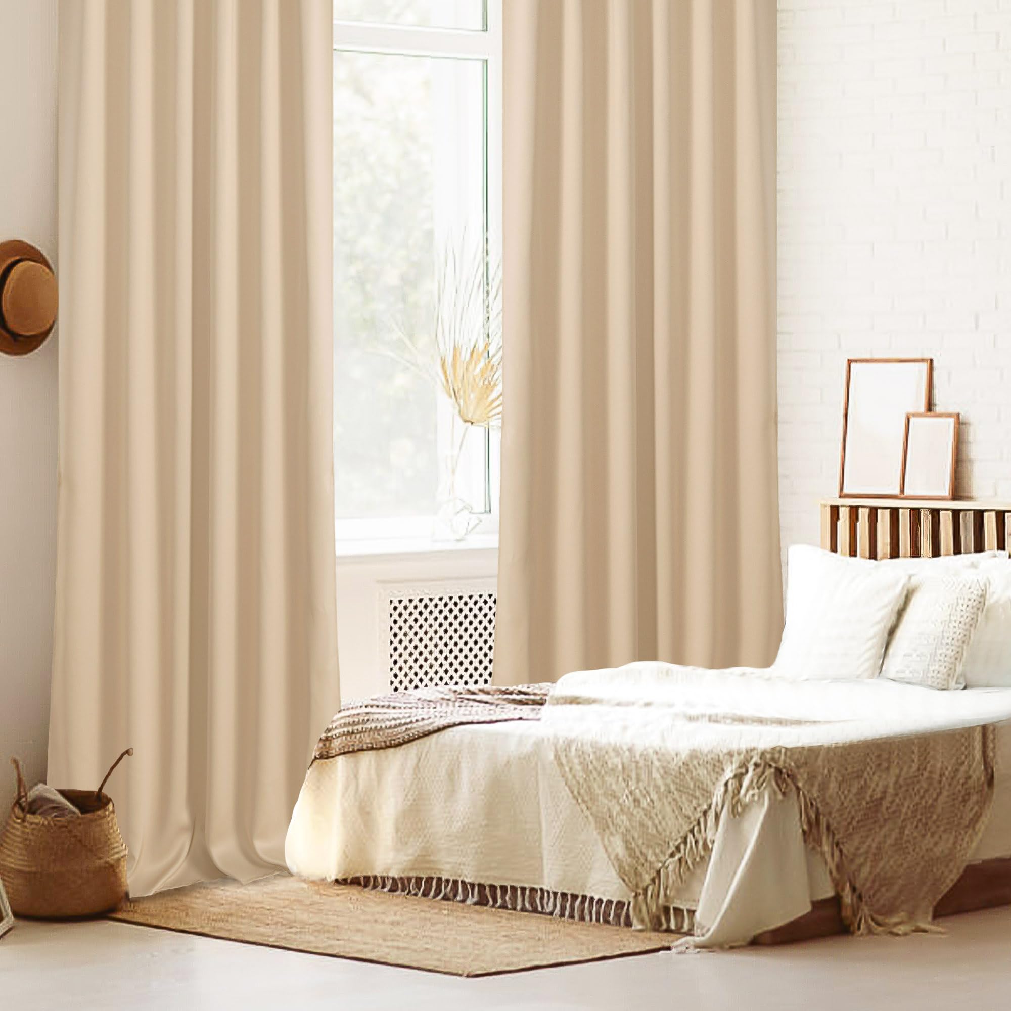 Set of two DWCN Blackout Curtains with tiebacks, rod pocket and back tab design, featuring a sleek black fabric for light blocking.