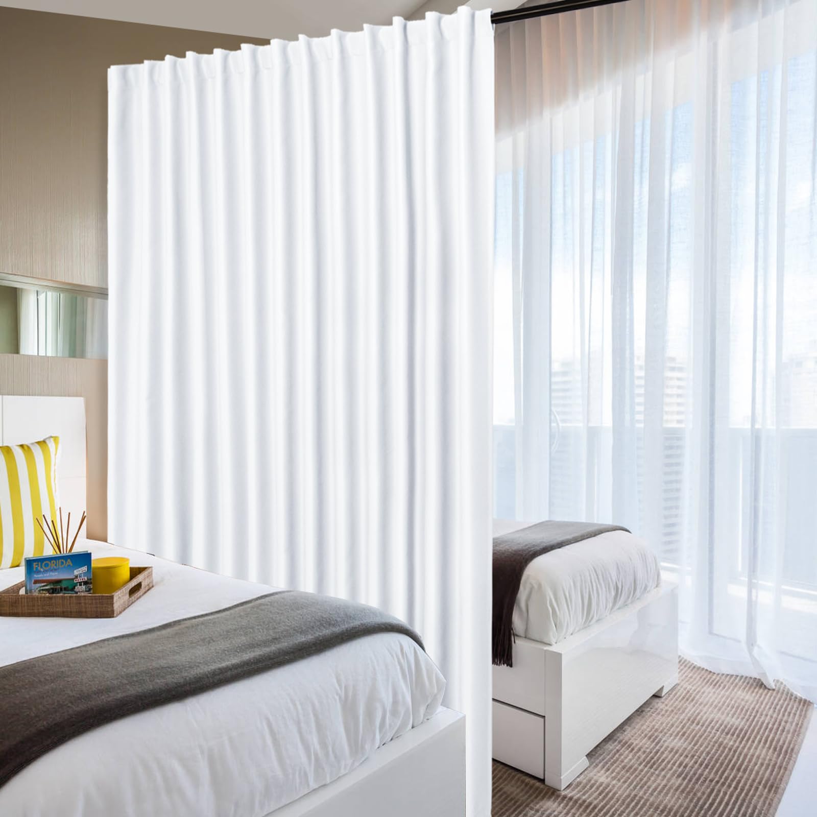 DWCN Official black blackout curtain panel, wide width room divider curtain hanging with metal grommets in a modern interior setting.