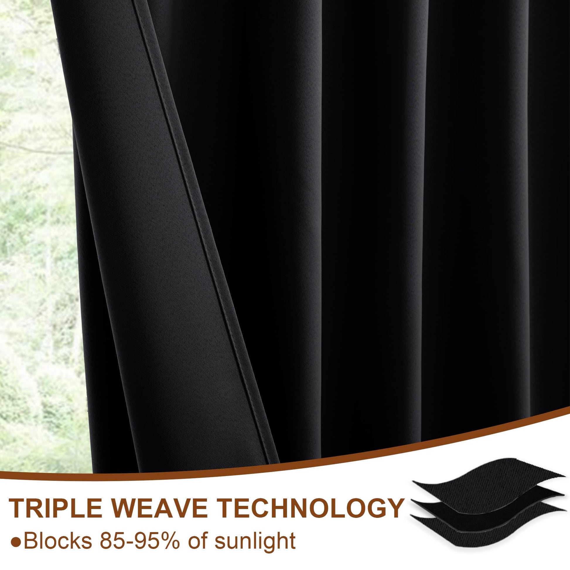 Set of two DWCN Official black blackout curtains with tiebacks, rod pocket and back tab design, hanging on a window.