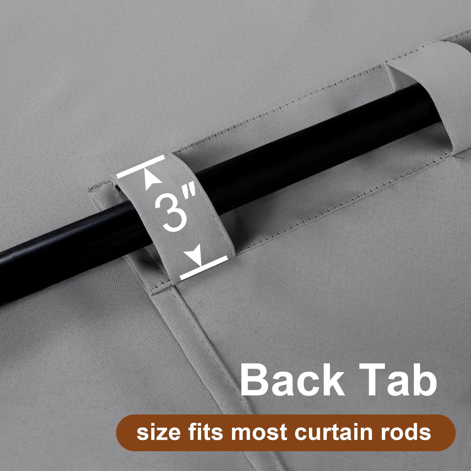 Pair of black DWCN blackout curtains with tiebacks, rod pocket and back tab design, set of two panels hanging on a window.