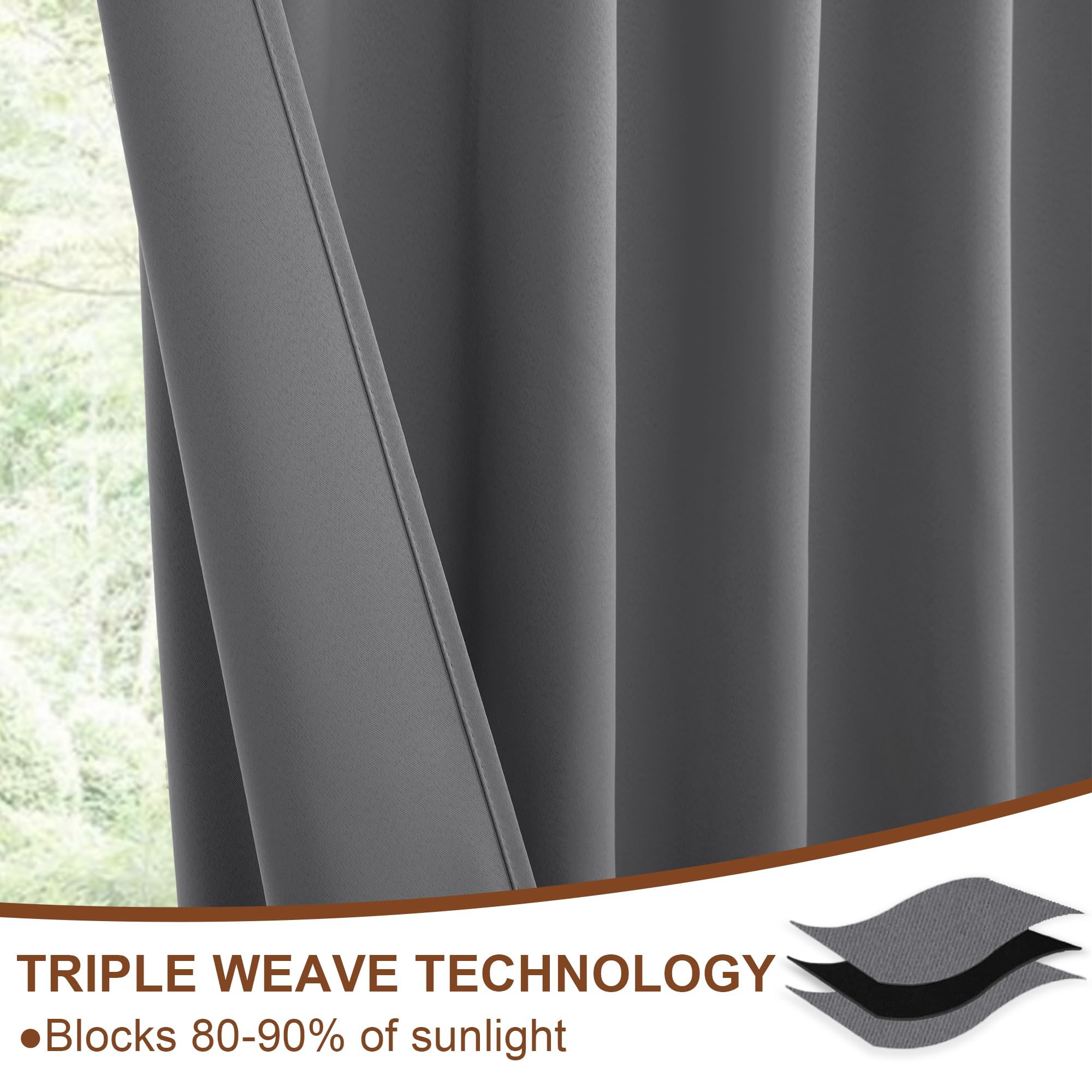 Two black DWCN Official blackout curtain panels with tiebacks, rod pocket and back tab design, hanging in a window setting.