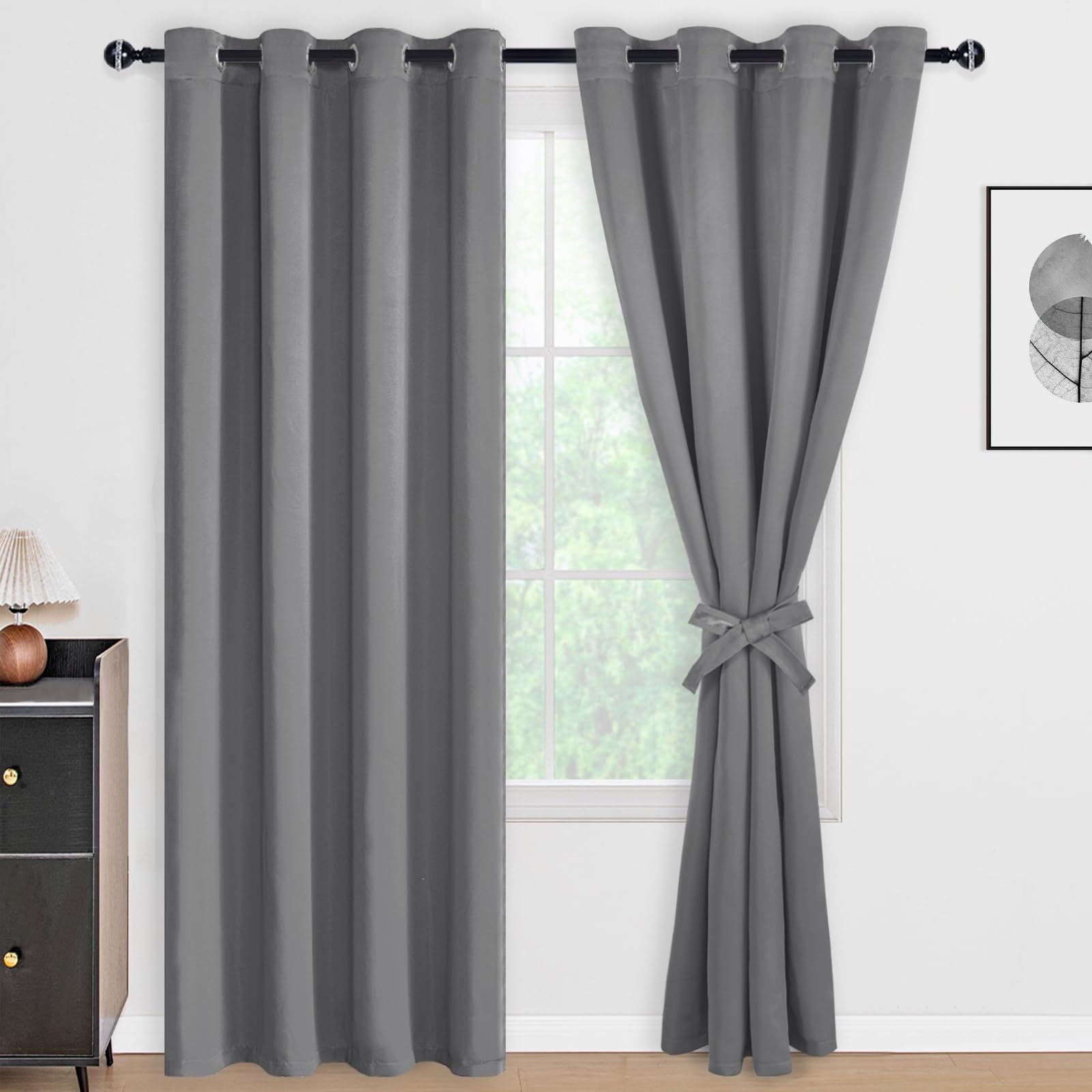 DWCN black blackout curtains with tiebacks, set of 2 panels, featuring dark fabric and elegant design for light blocking and privacy.