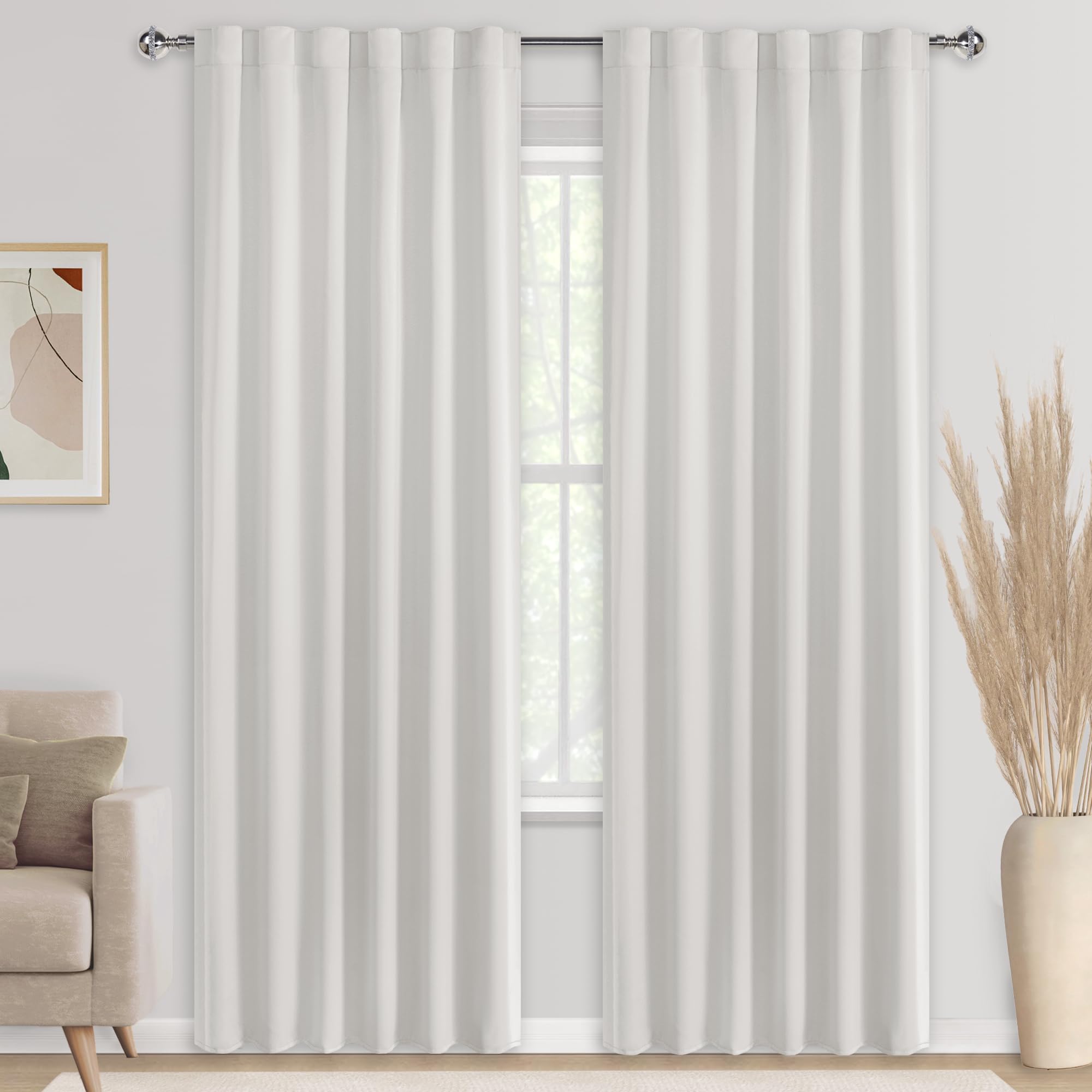 Set of two DWCN Blackout Curtains with tiebacks, rod pocket and back tab design, shown hanging in a window.
