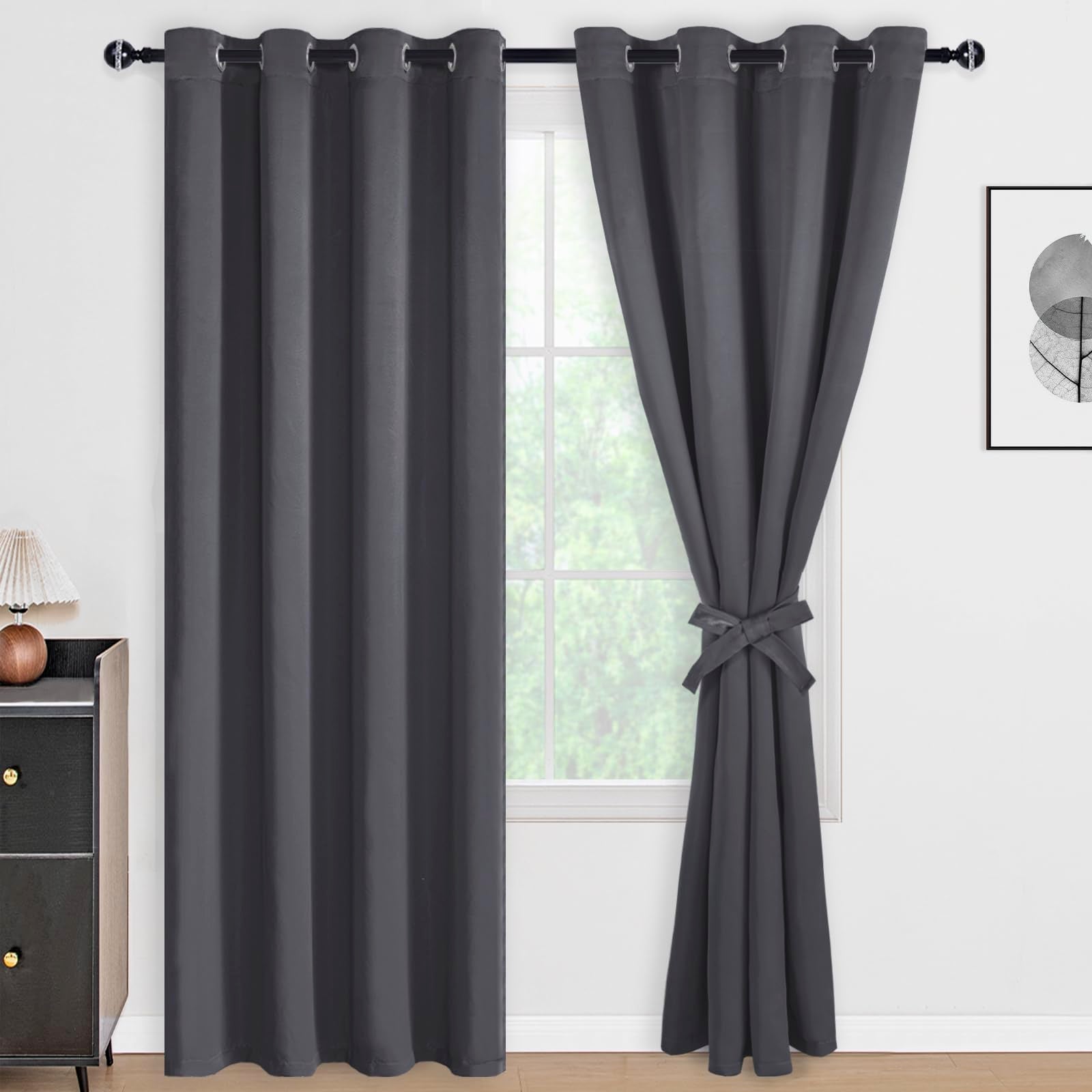 Set of two DWCN blackout curtains with tiebacks, black fabric panels designed for light blocking and privacy.